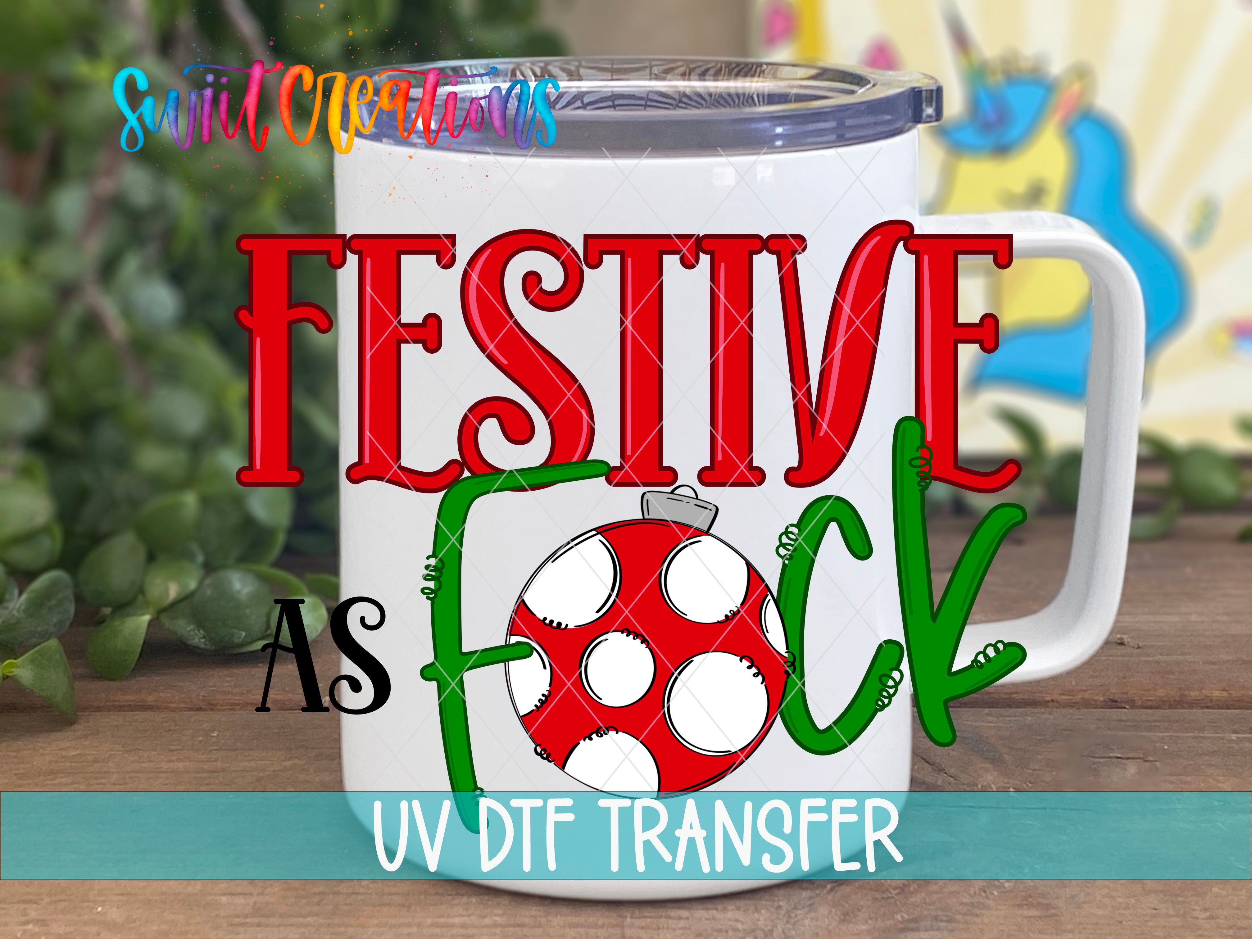 A white mug with a red and green design, featuring the text "FESTIVE AS FOCK" and a red and white polka dot pattern.