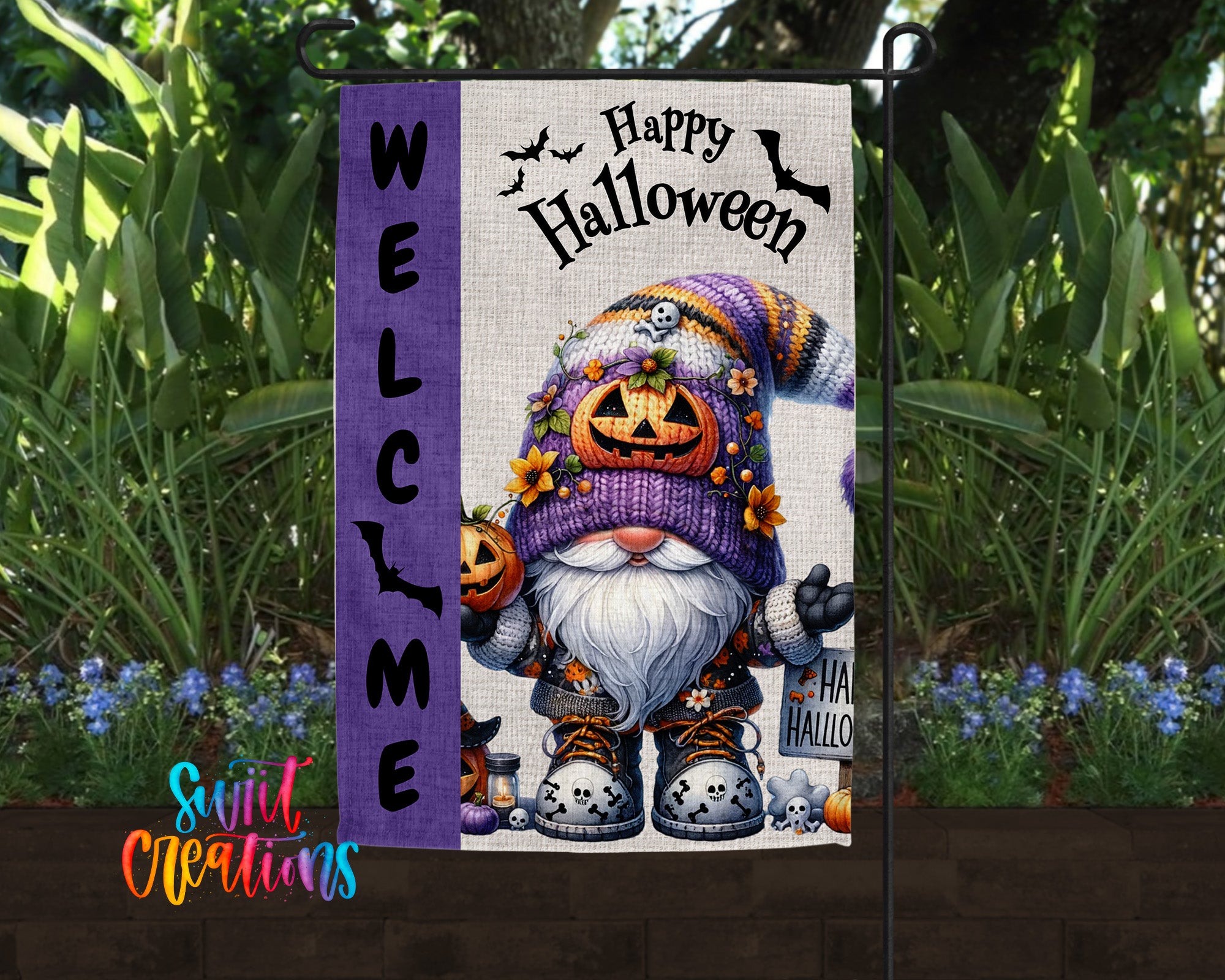 A Halloween-themed garden sign featuring a gnome character with a pumpkin hat and a "Happy Halloween" message.