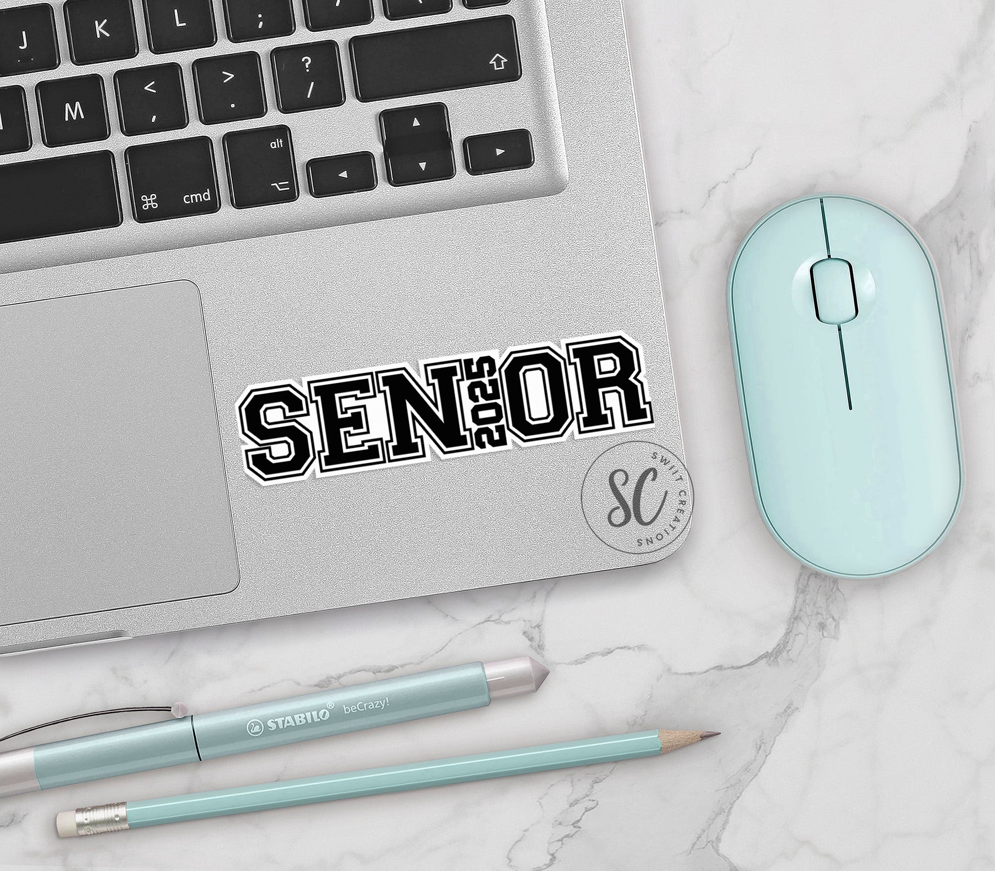 a laptop computer sitting on top of a white table