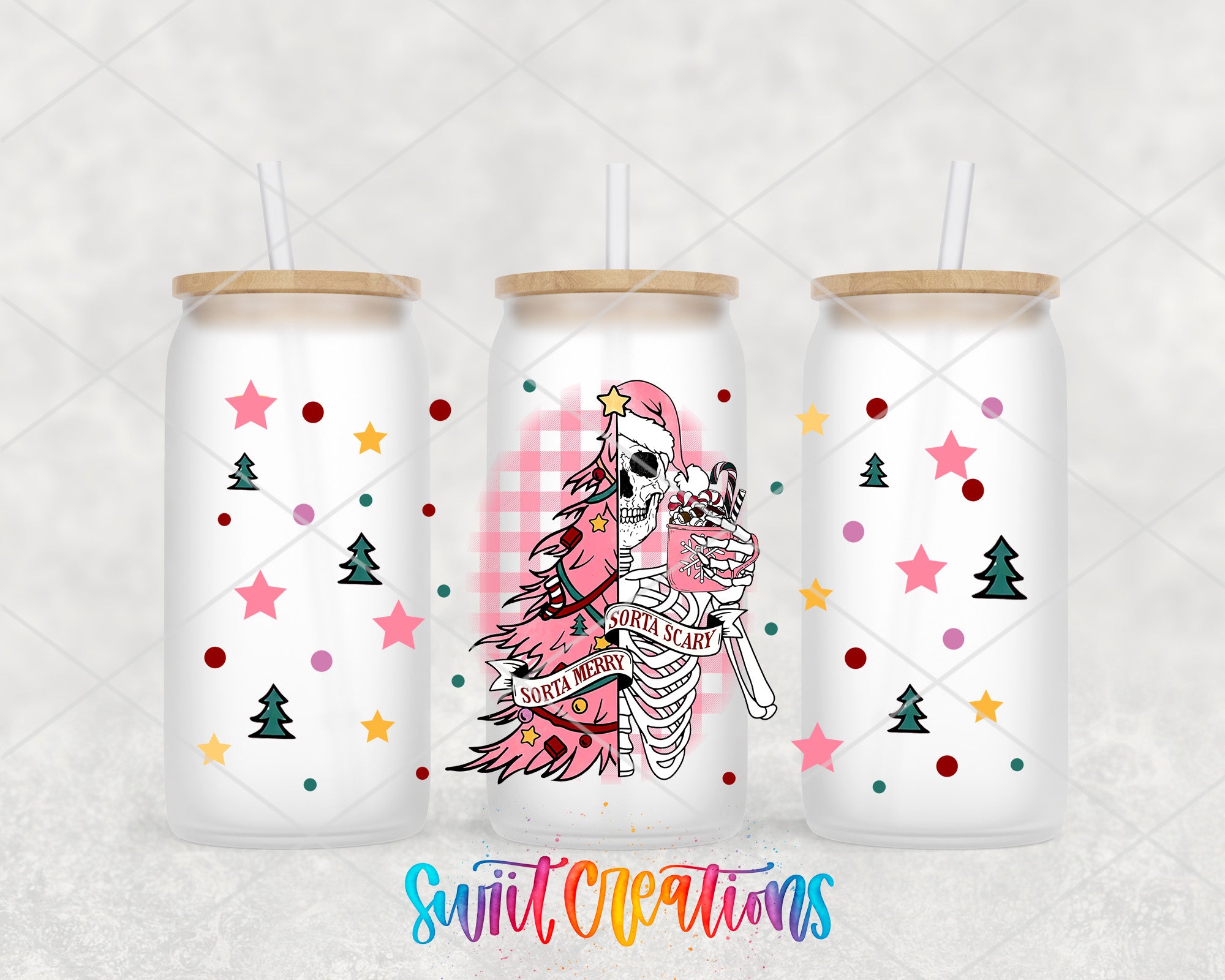 three white tumblers with colorful and whimsical designs on them. The designs include stars, pine trees, and a skeleton figure. The tumblers have wooden lids and straws.