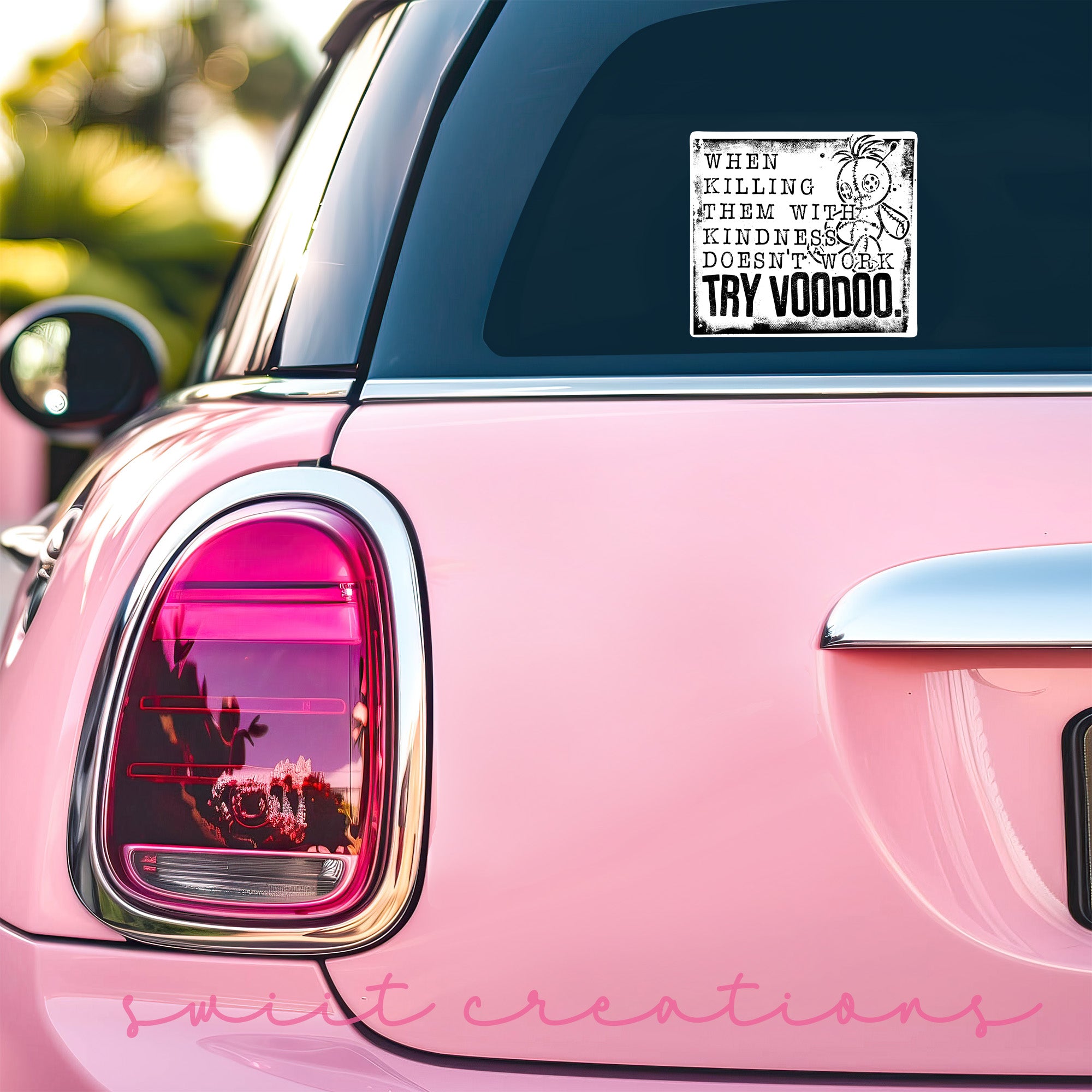 a pink car that has a sticker on it