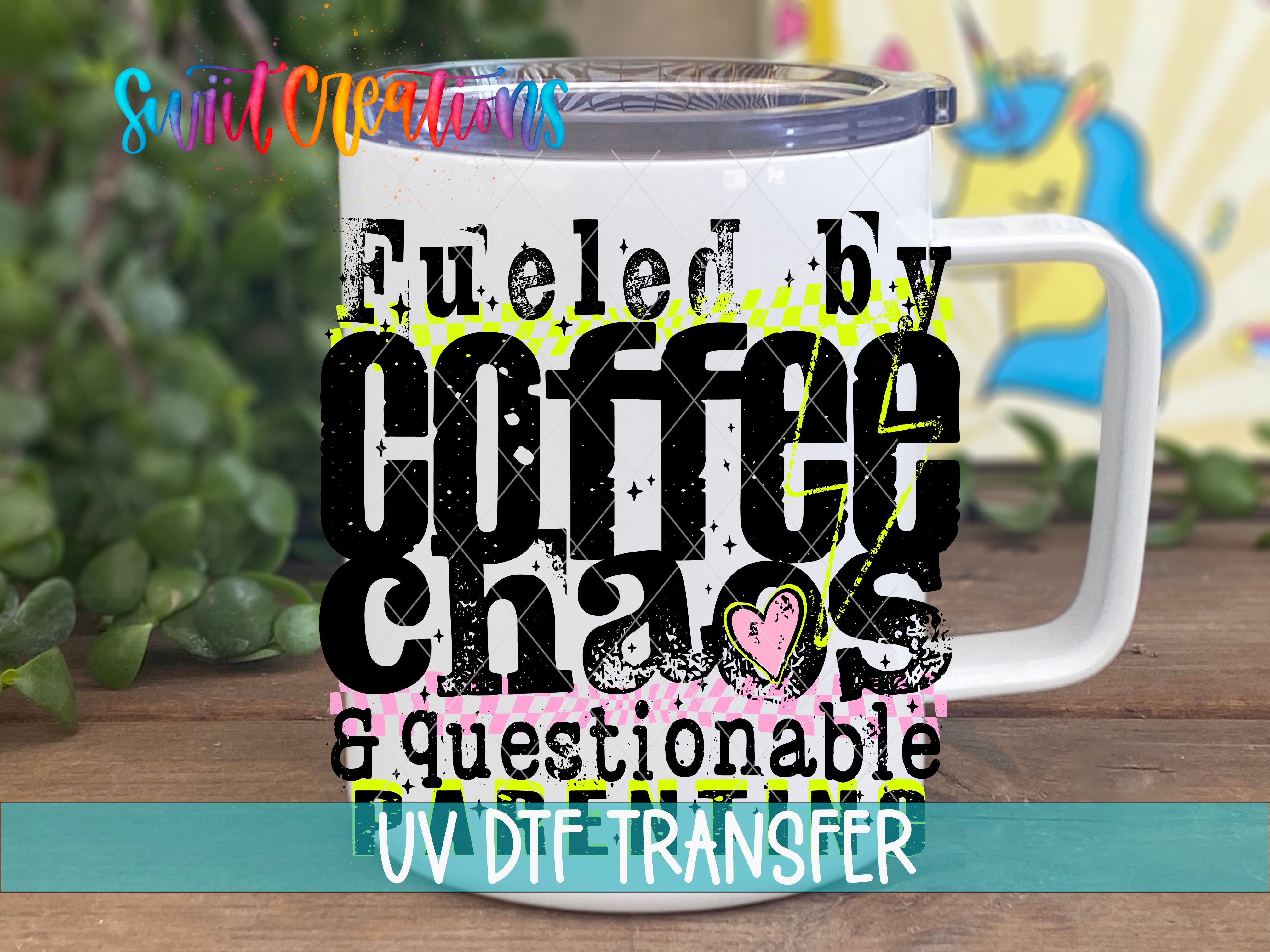 A white mug with a printed design that says "Fuelled by Coffee Chaos & questionable DTF Transfer" in bold, colorful text.