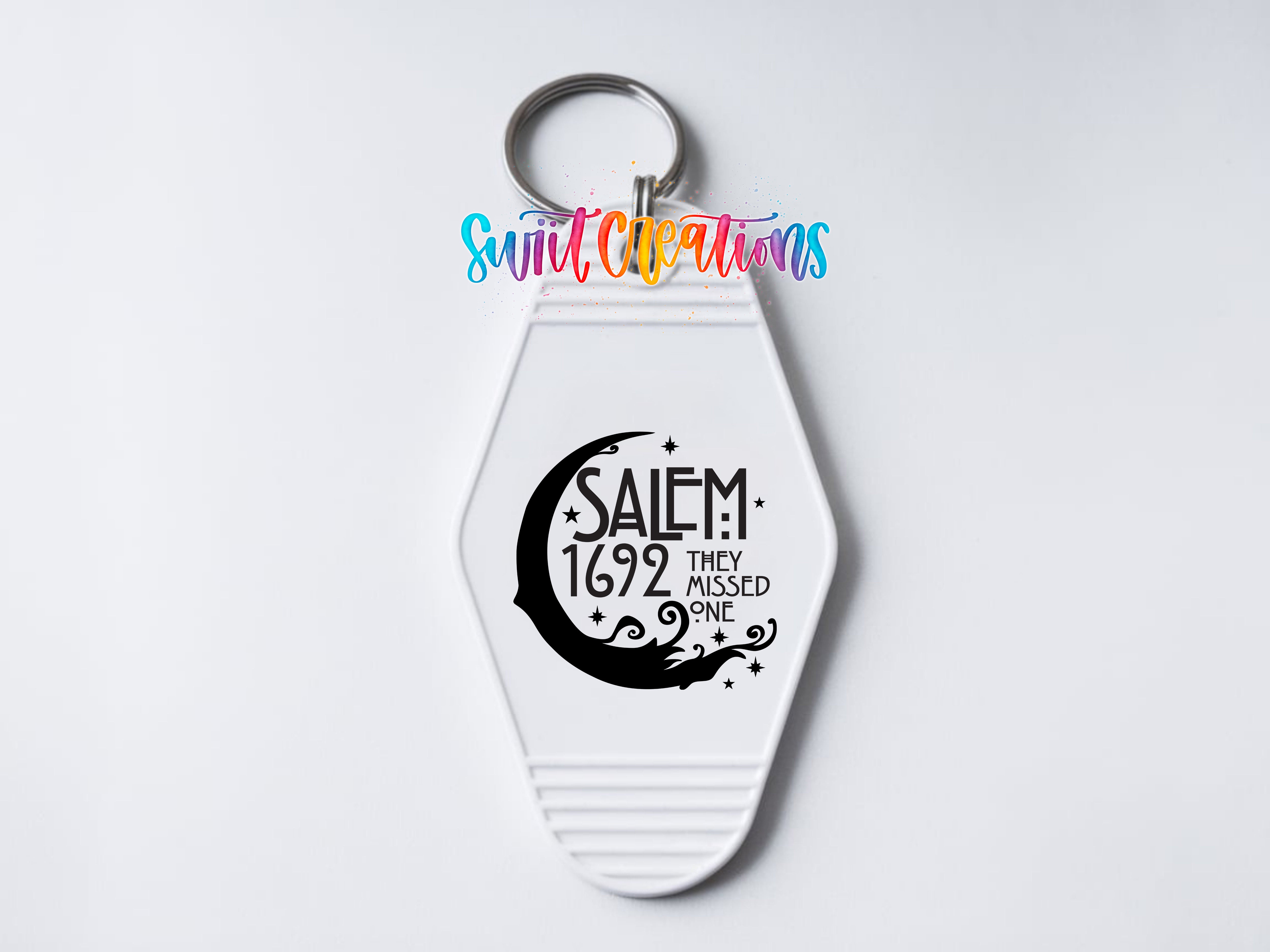 A keychain with a keyring and a printed design on it.
