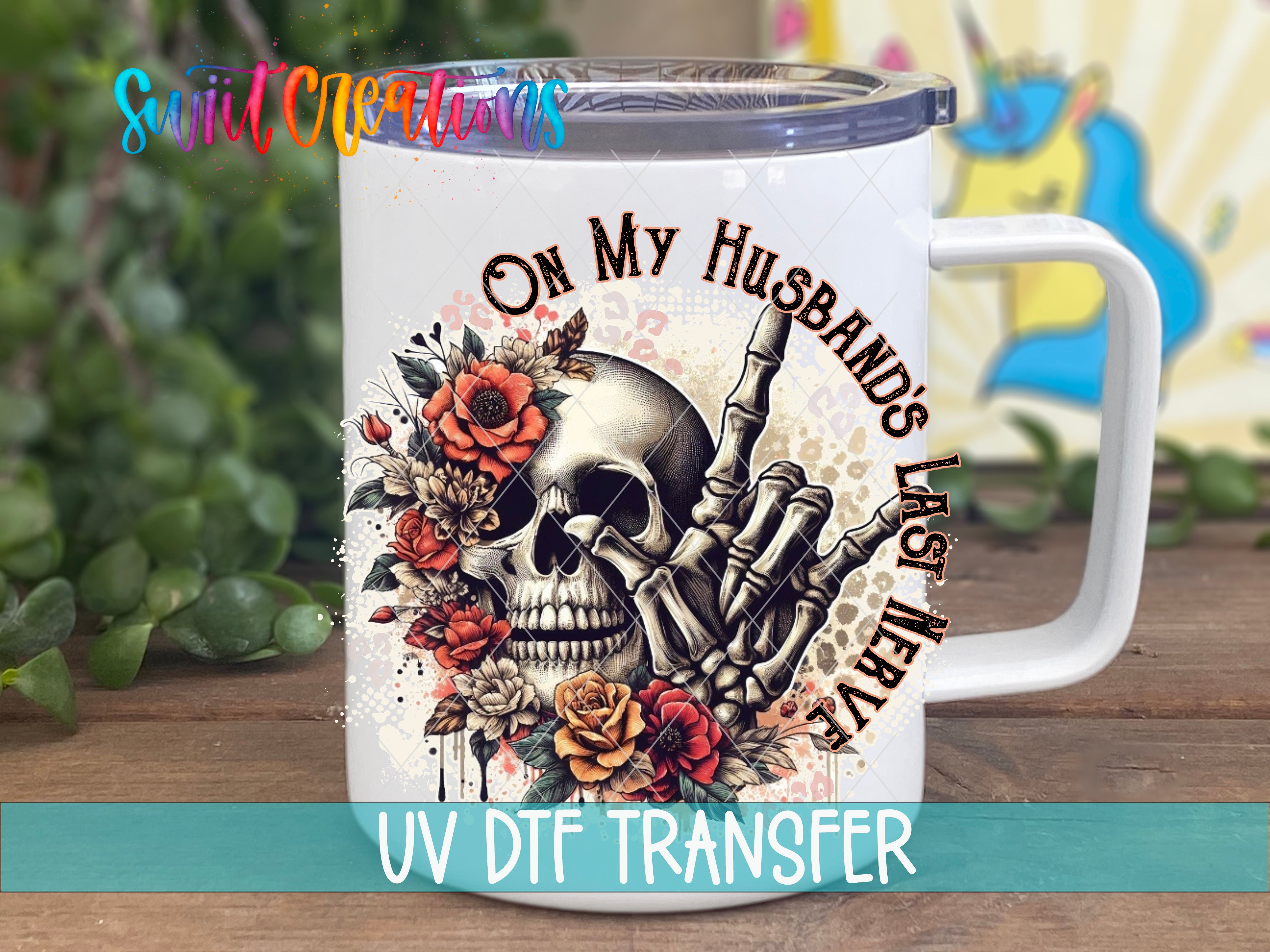 A white ceramic mug with a skull design and floral elements, along with the text "On My Husband's Last Night" printed on it.