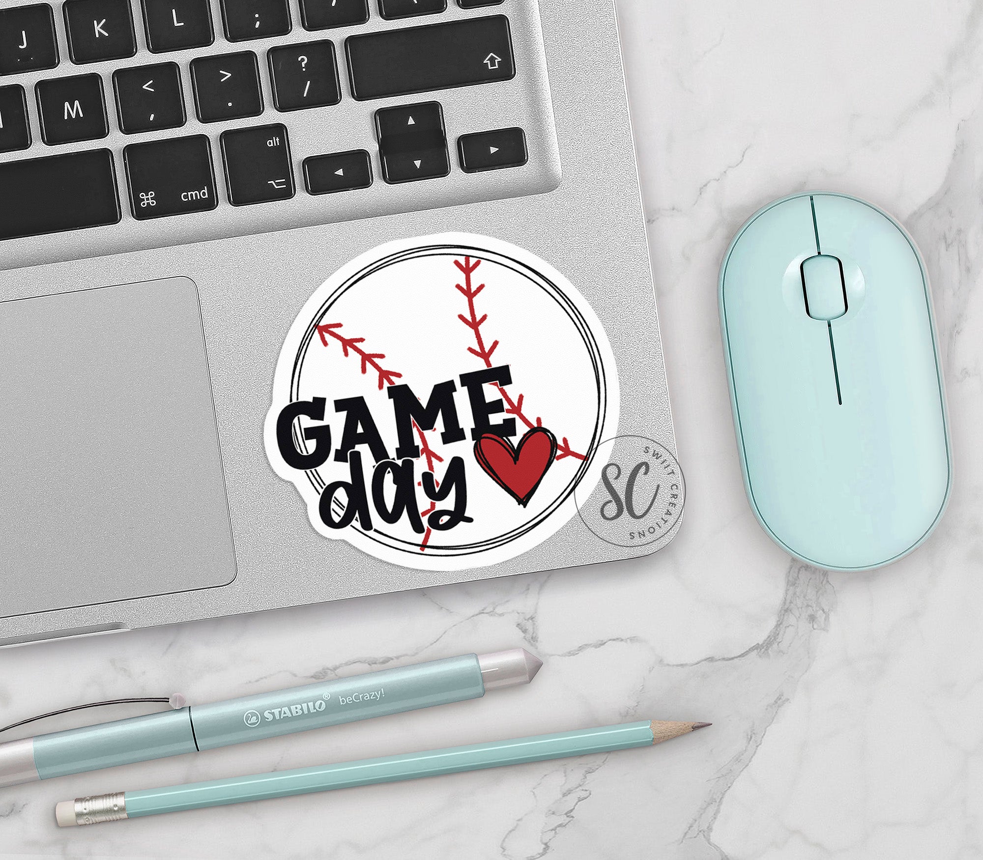 a laptop computer sitting next to a mouse and keyboard