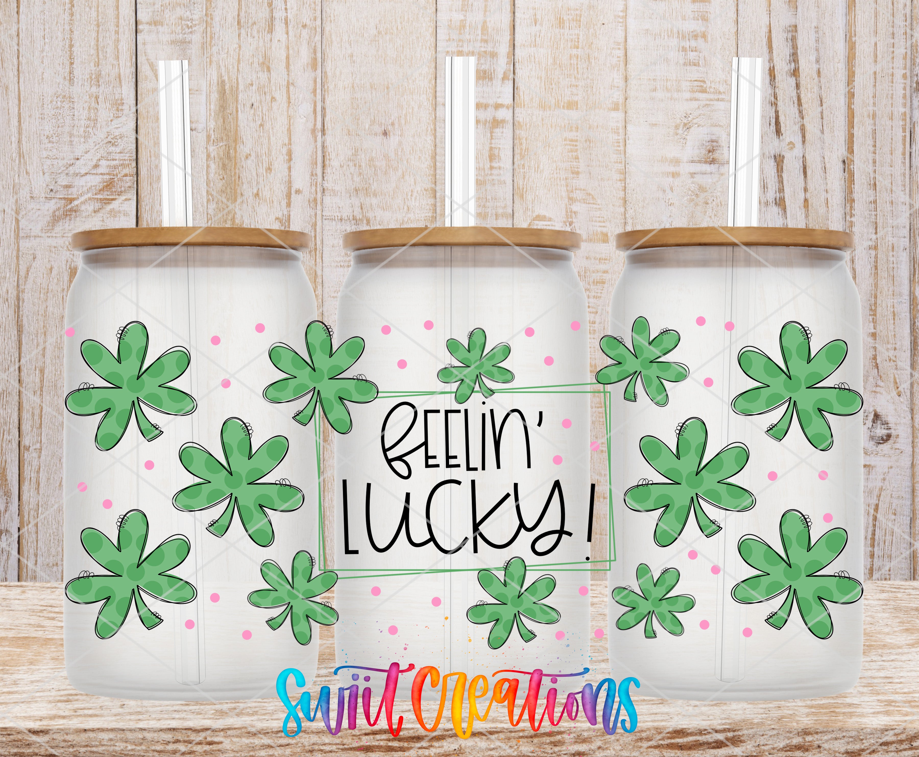 three glass tumblers with a shamrock design and the text "Feelin' Lucky!" written on them.