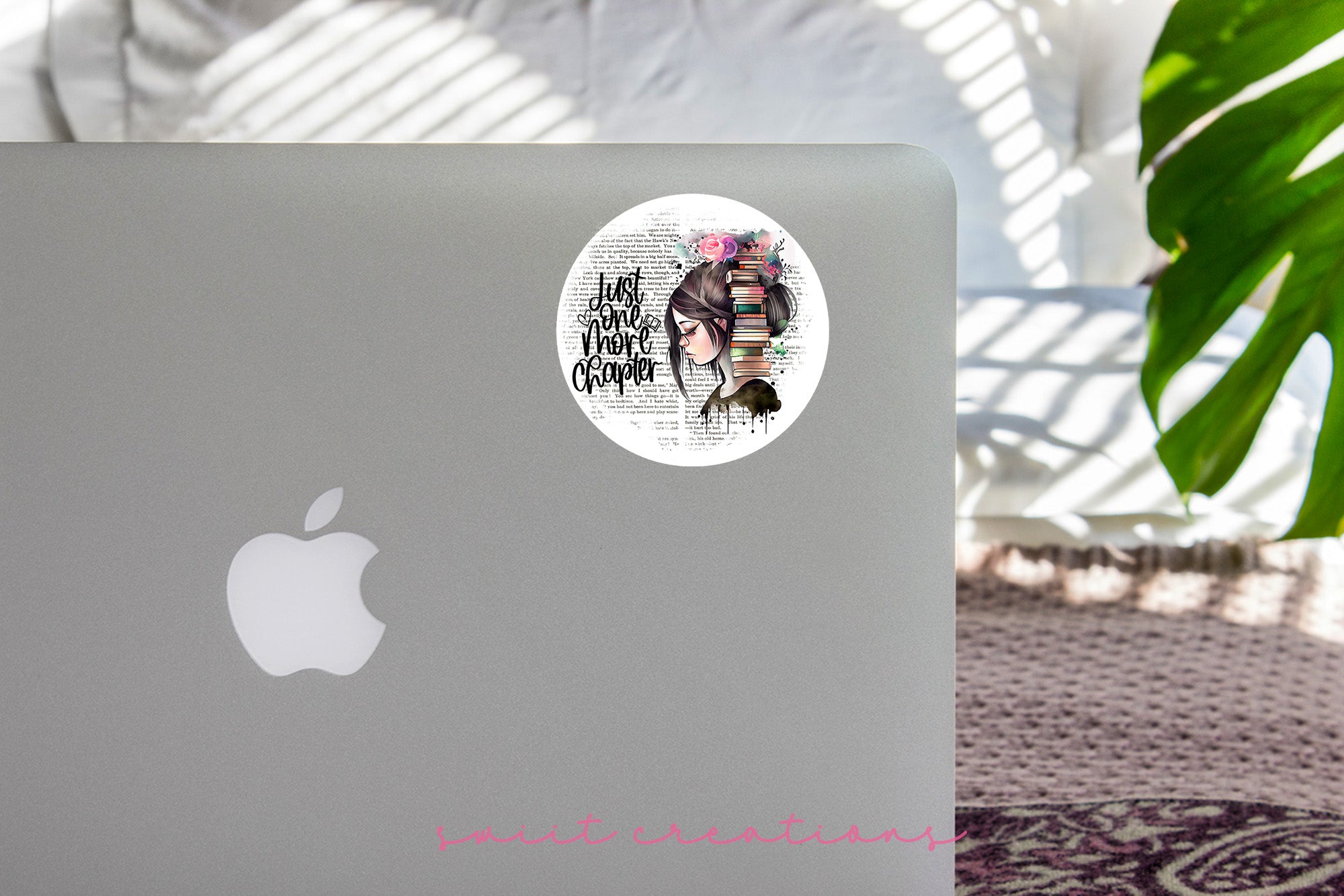 a laptop with a sticker of a woman's face