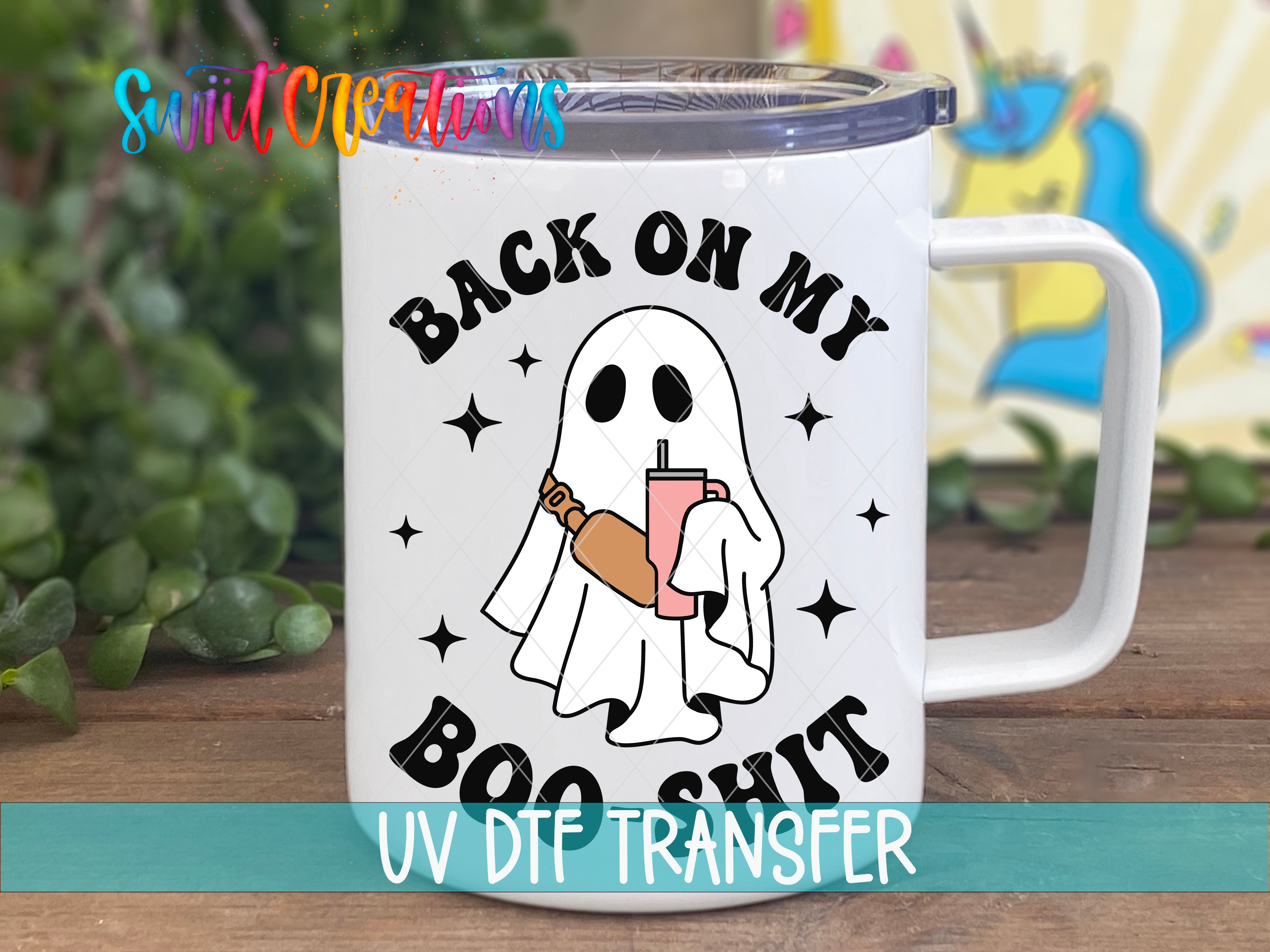 A white mug with a graphic design featuring a ghost holding a drink and the text "BACK ON MY BOO SHIT" printed on it.