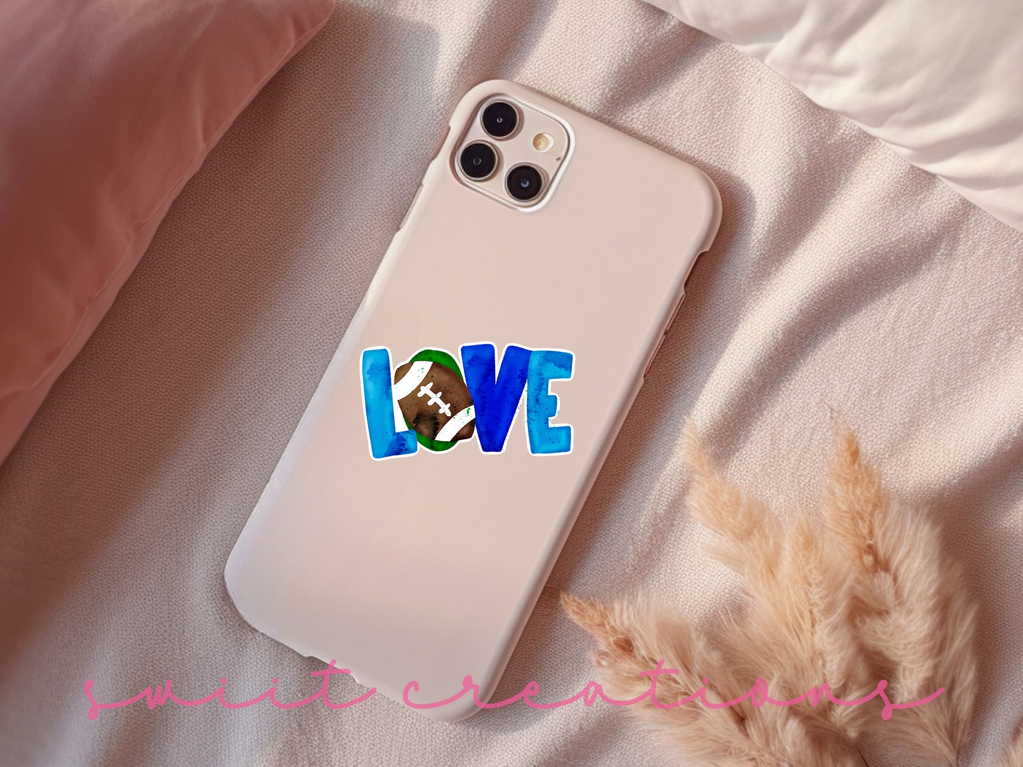 a phone case with a love football sticker on it