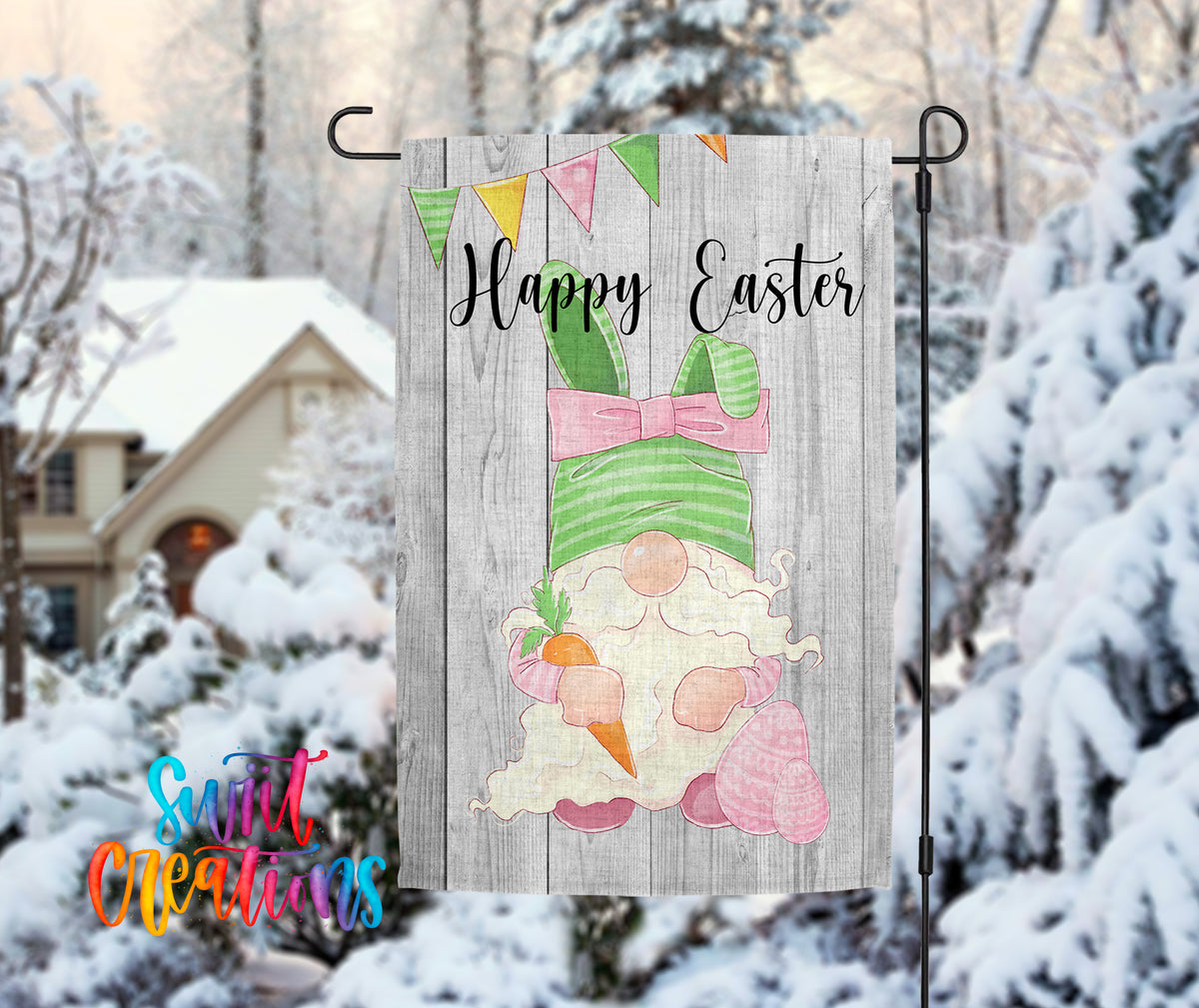 A wooden Easter banner with a gnome holding a carrot and a banner with the text "Happy Easter" is displayed in front of a snowy house.