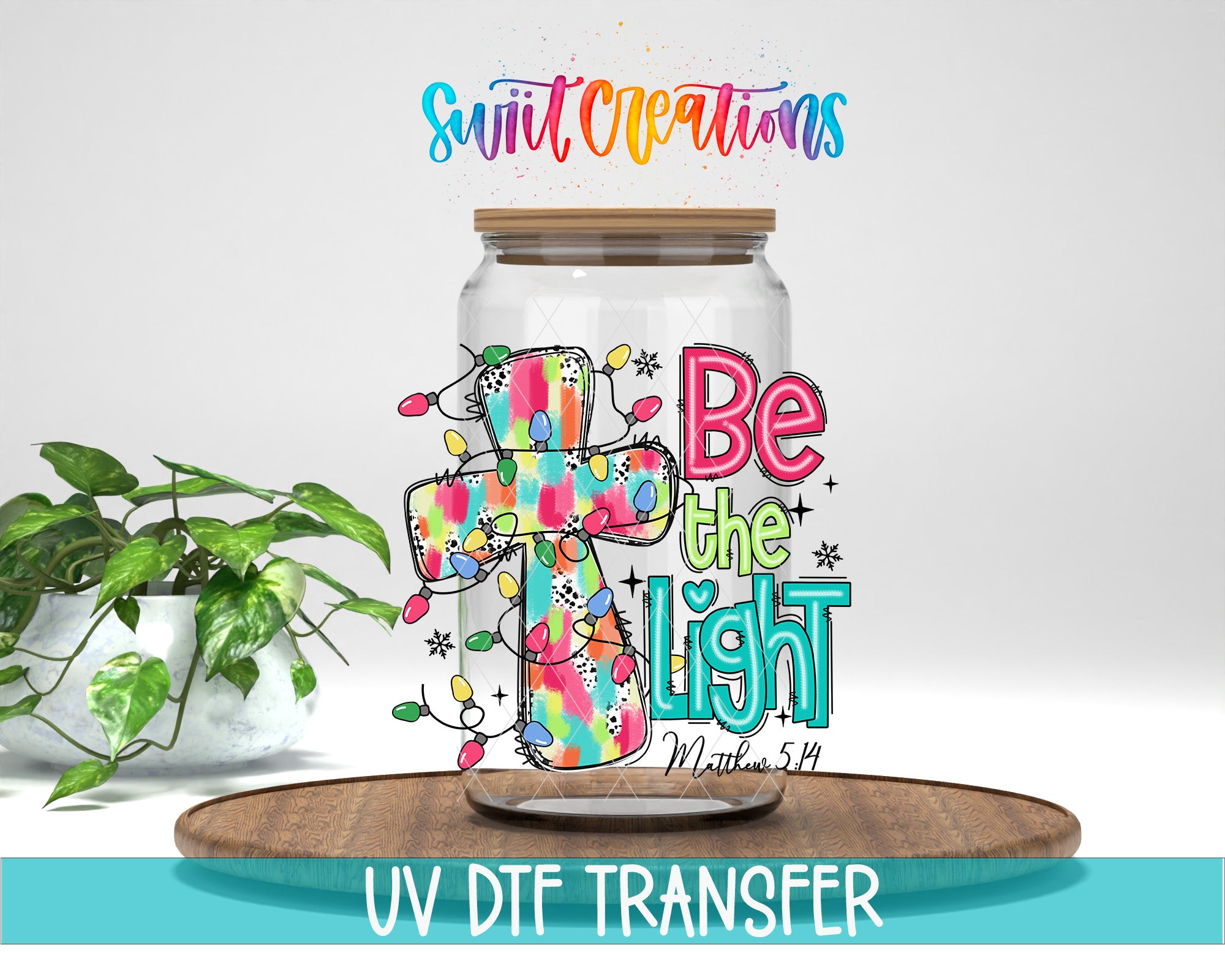 a glass jar with a colorful design and text, placed on a wooden surface.