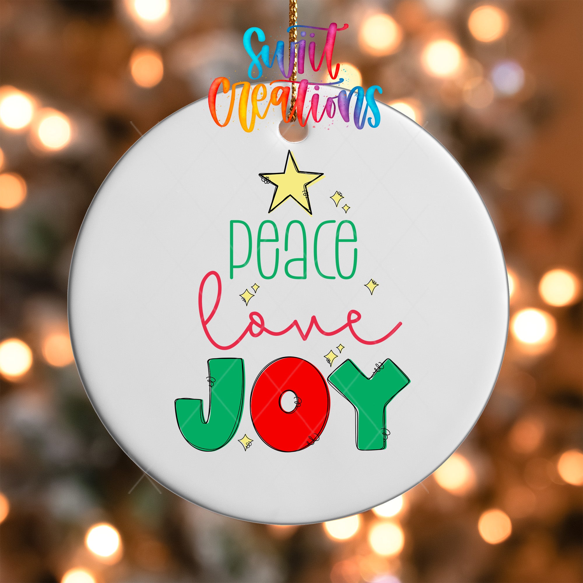 A white ornament with a colorful design featuring the text "Peace Love Joy" and a star.