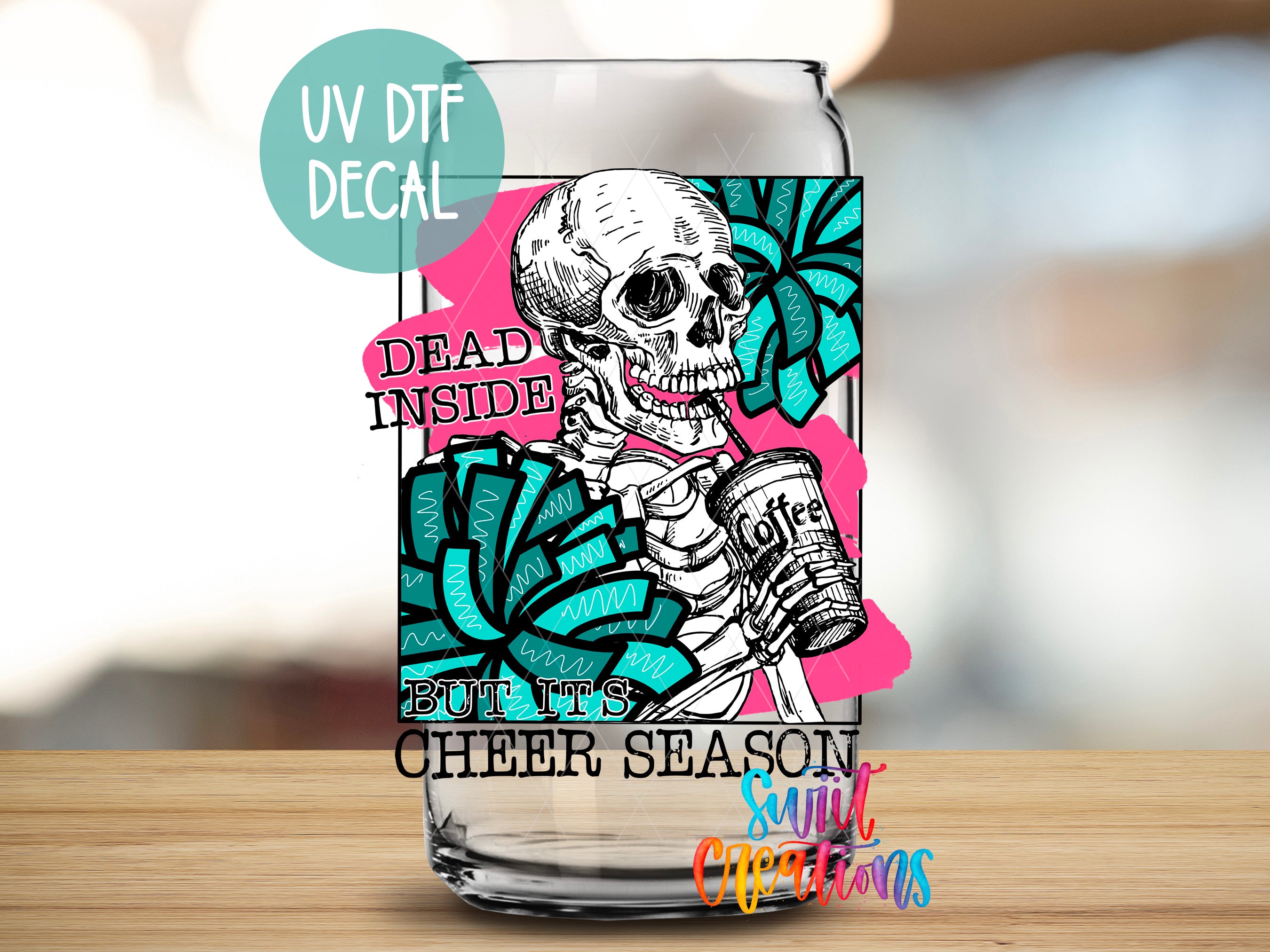 a glass with a picture of a skeleton holding a camera