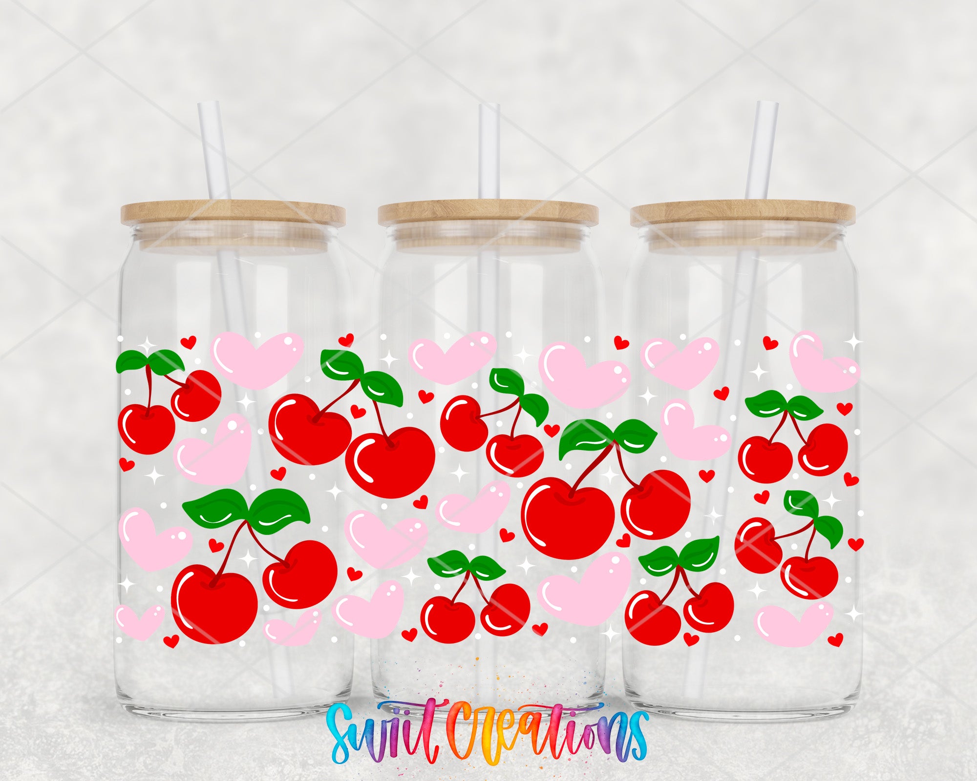 Three glass jars with wooden lids, each filled with a red cherry design and a white heart.