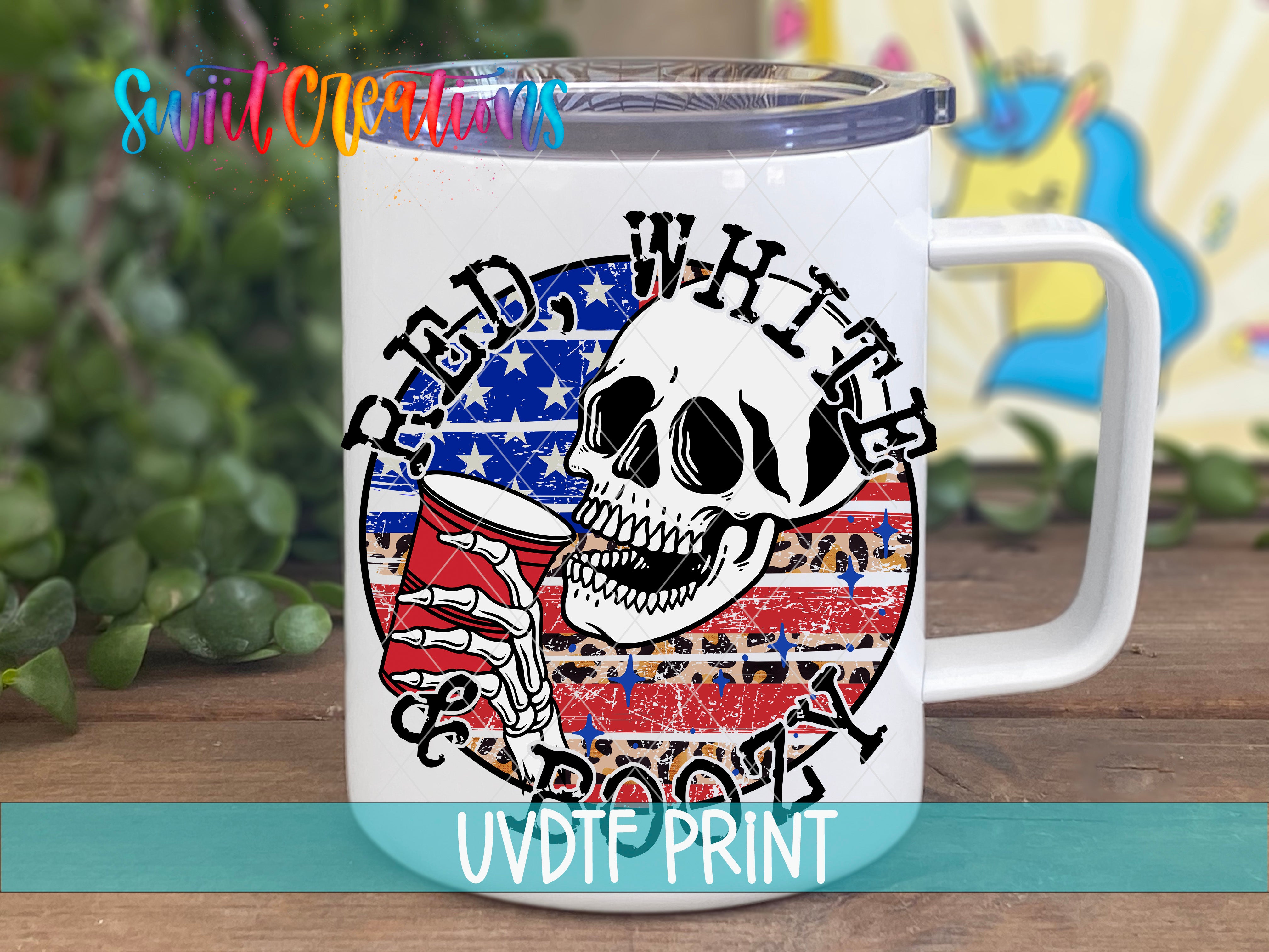 A white mug with a graphic design featuring a skull, a red cup, and an American flag pattern.
