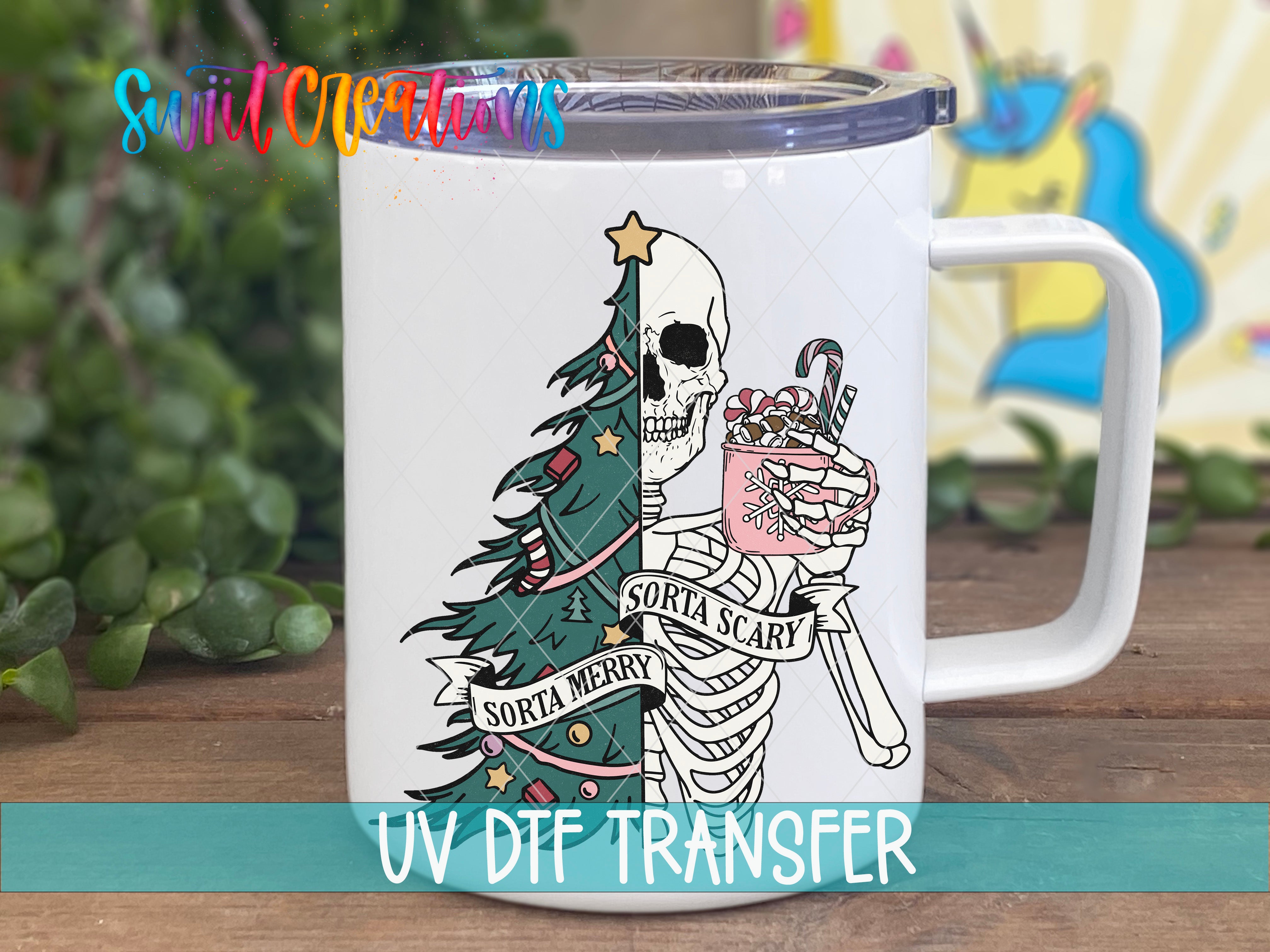 A white mug with a colorful illustration of a skeleton holding a Christmas tree and a mug of hot chocolate.