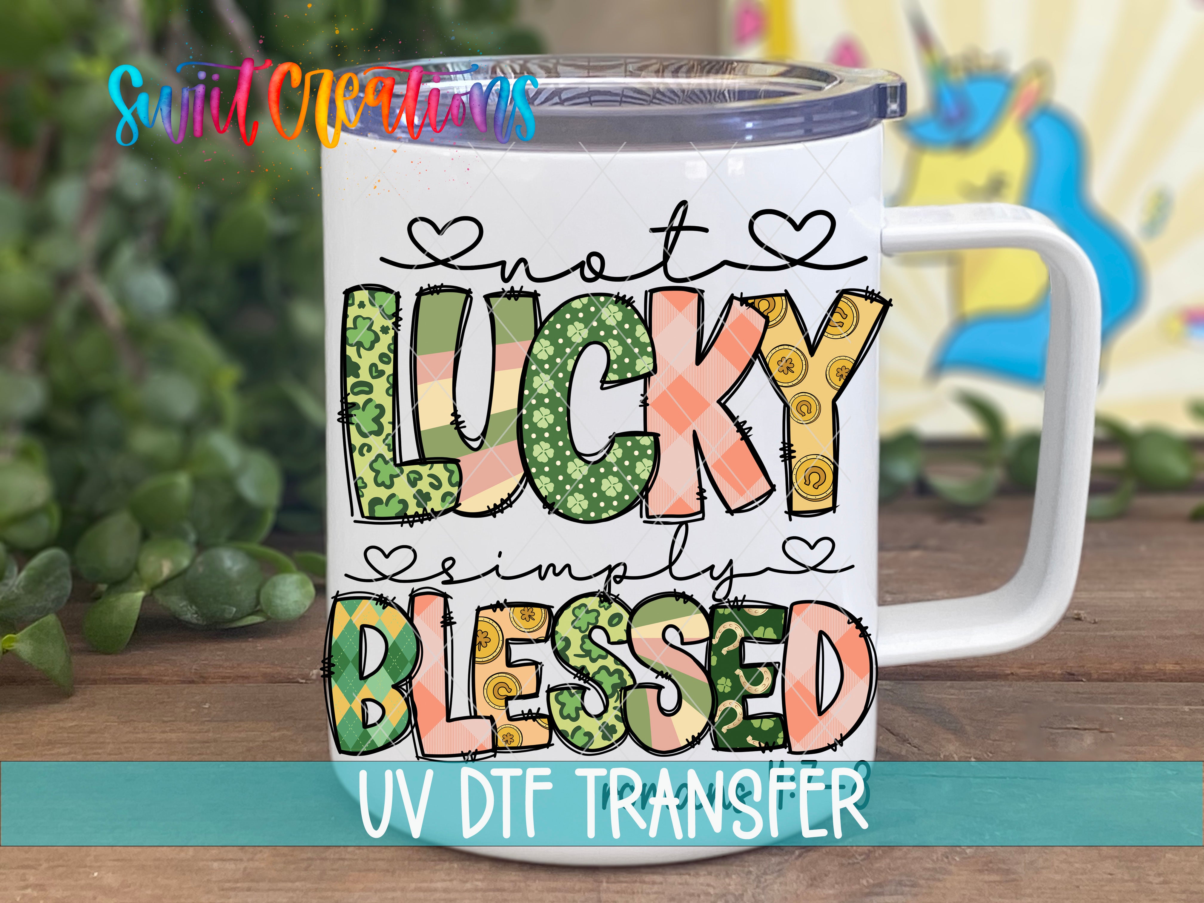 A white mug with colorful text and graphics printed on it, placed on a wooden surface.