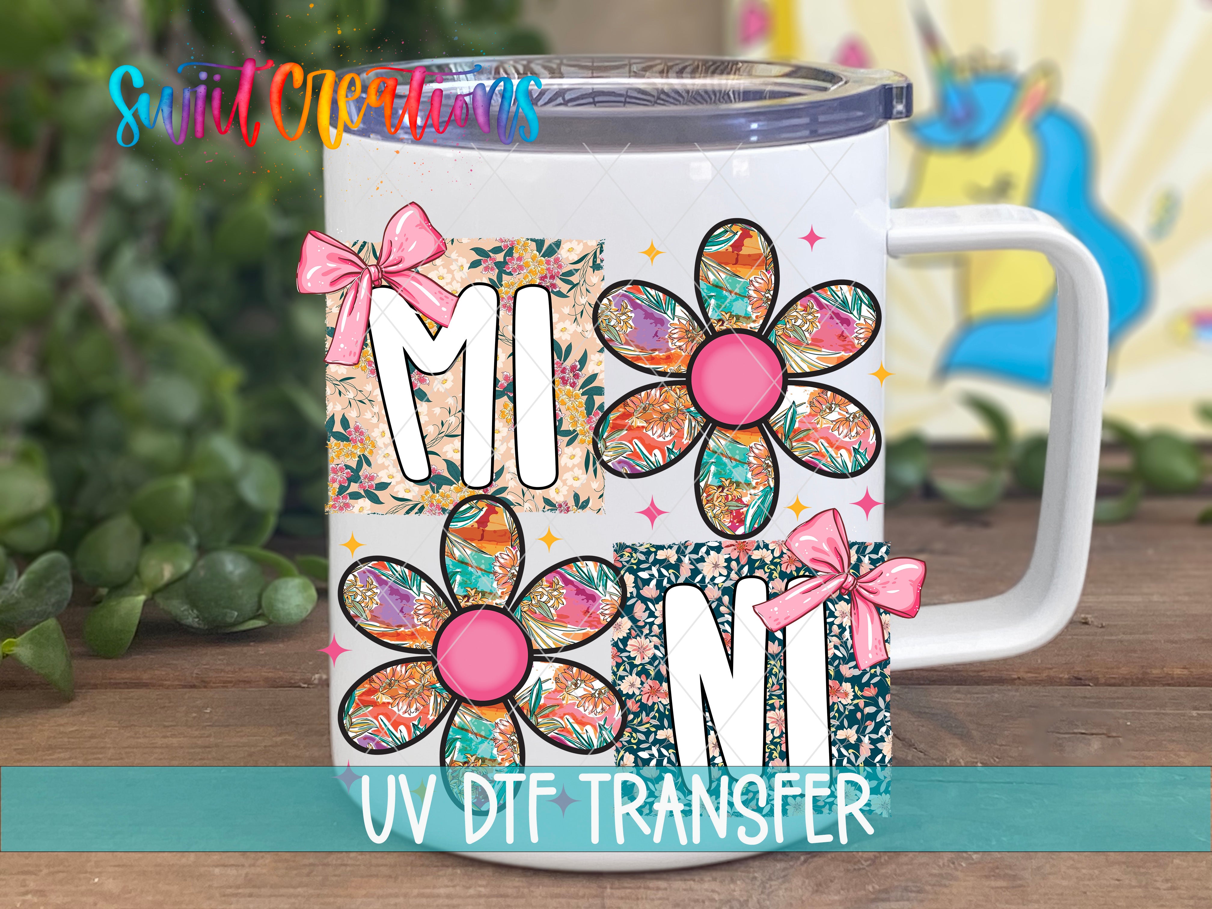 A white ceramic mug with colorful floral designs and bows, along with the text "UV DFT Transfer" indicating that the mug is a UV transferable item.