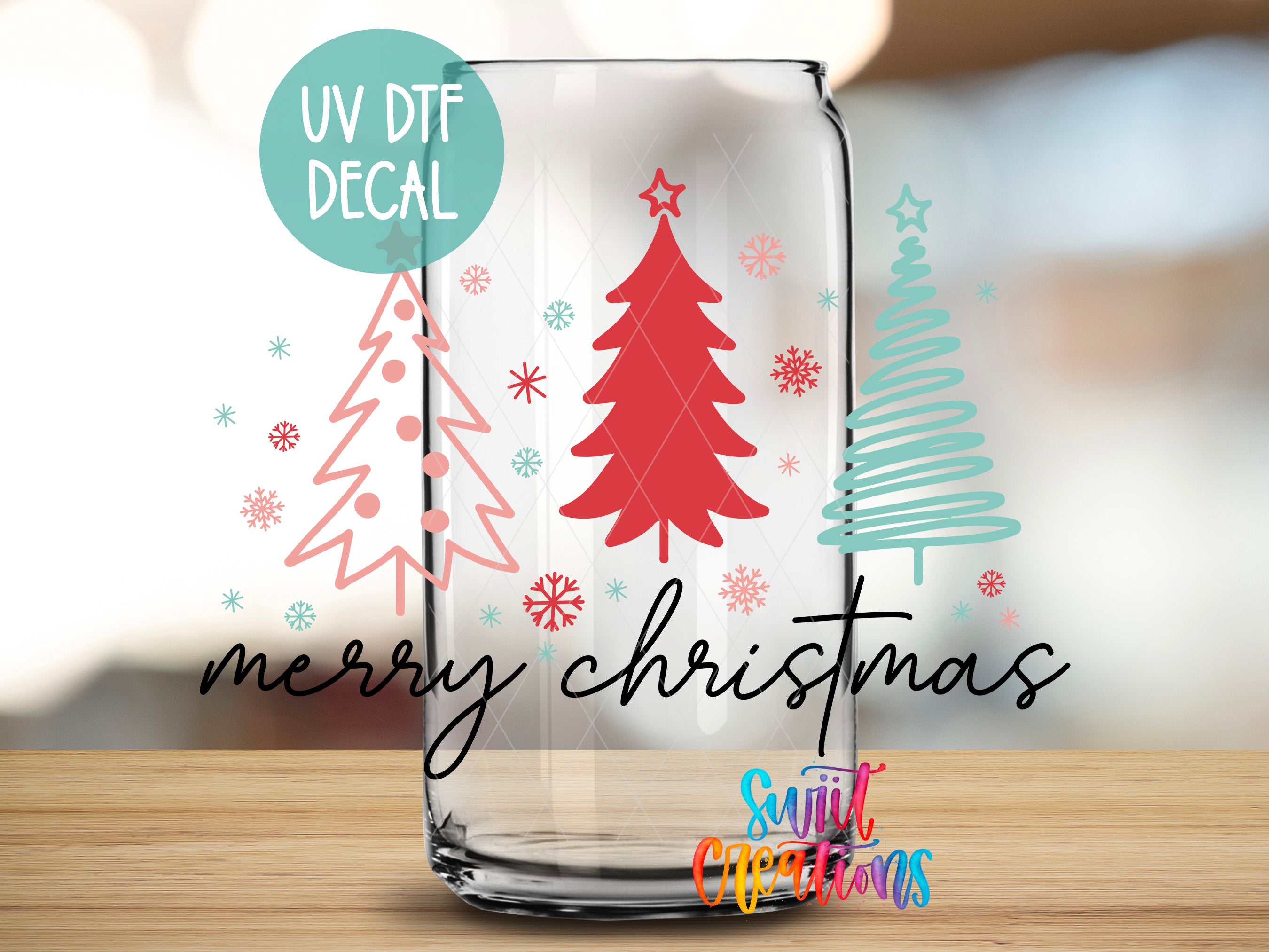 a glass with a christmas tree on it