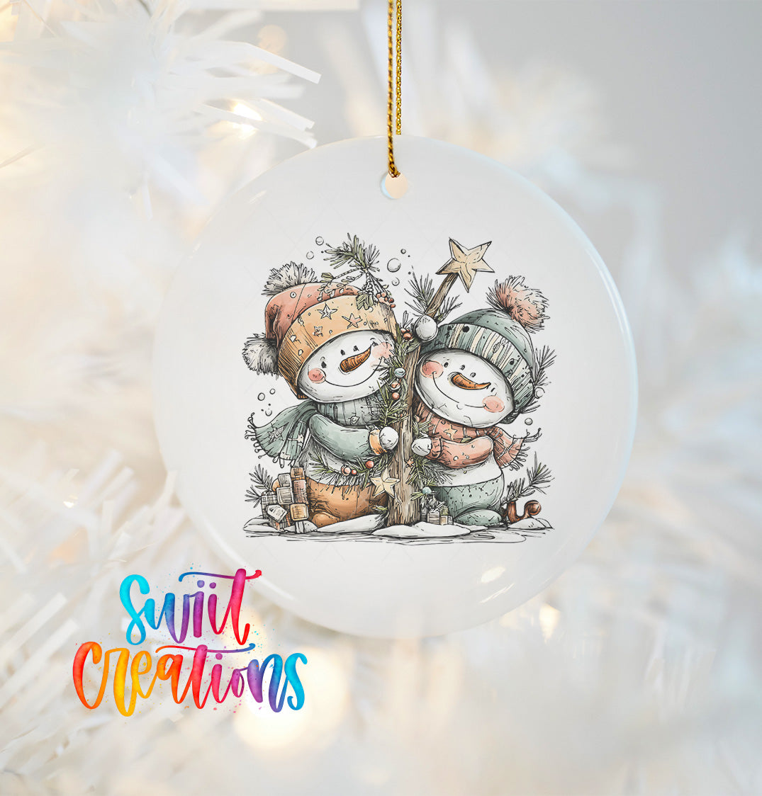A white ornament with a snowman and star on a Christmas tree, with the text "Swift Creations" written in colorful cursive letters.