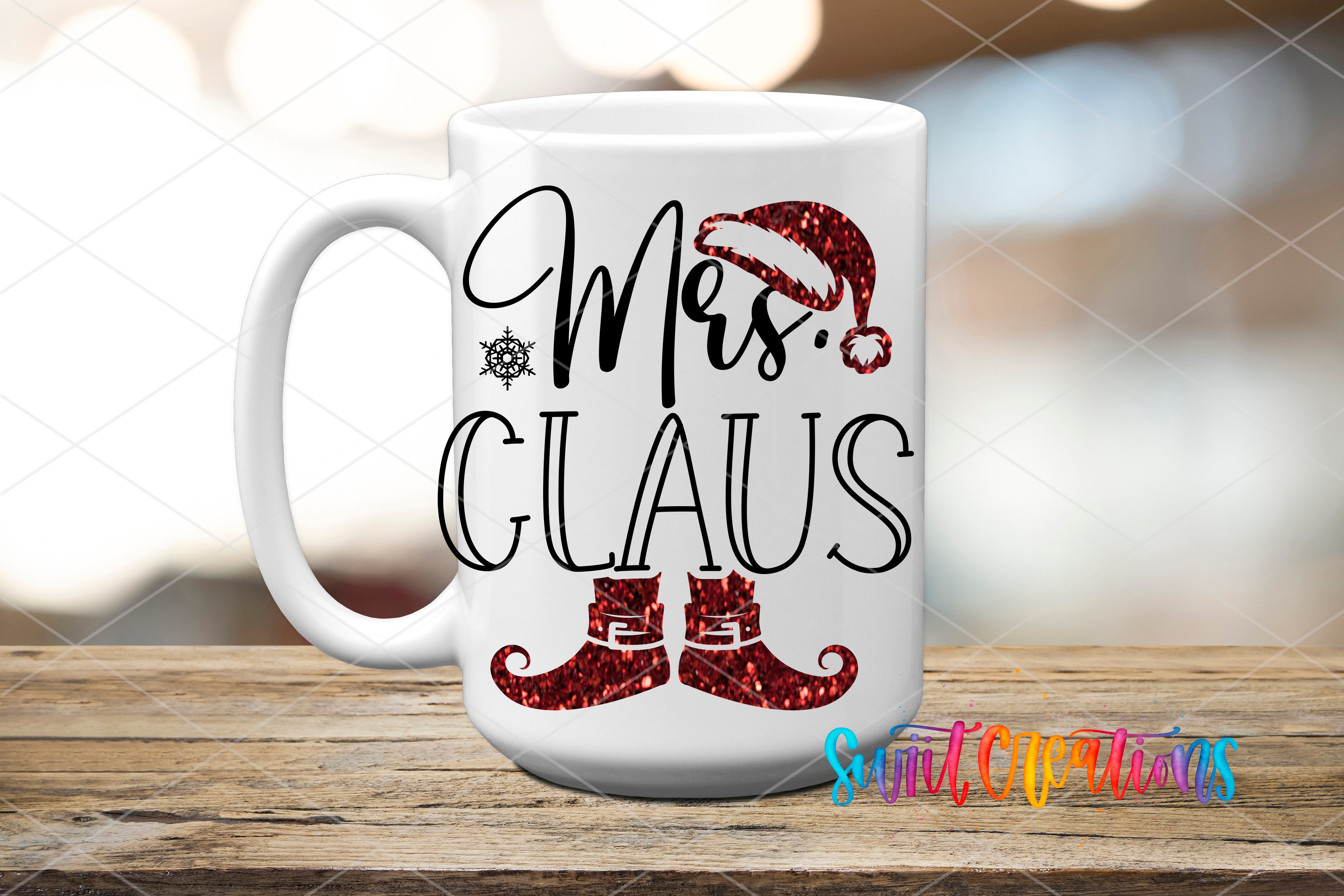A white mug with the text "Mrs. Claus" and a graphic of a Santa hat and red glitter shoes on it, placed on a wooden surface.
