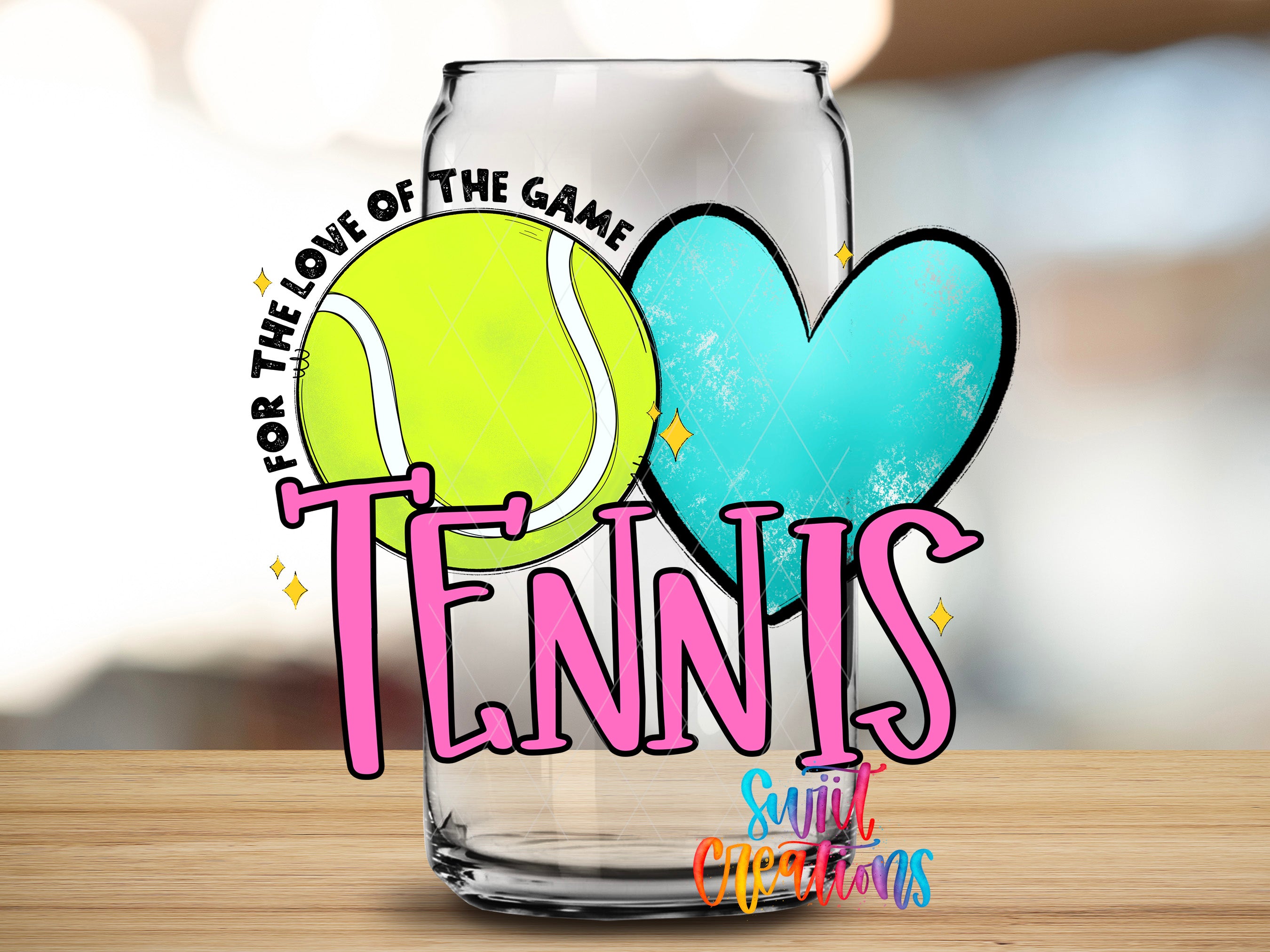 A glass can with a tennis ball and a heart on it, along with the text "TENNIS" and "Love of the Game" written on it.