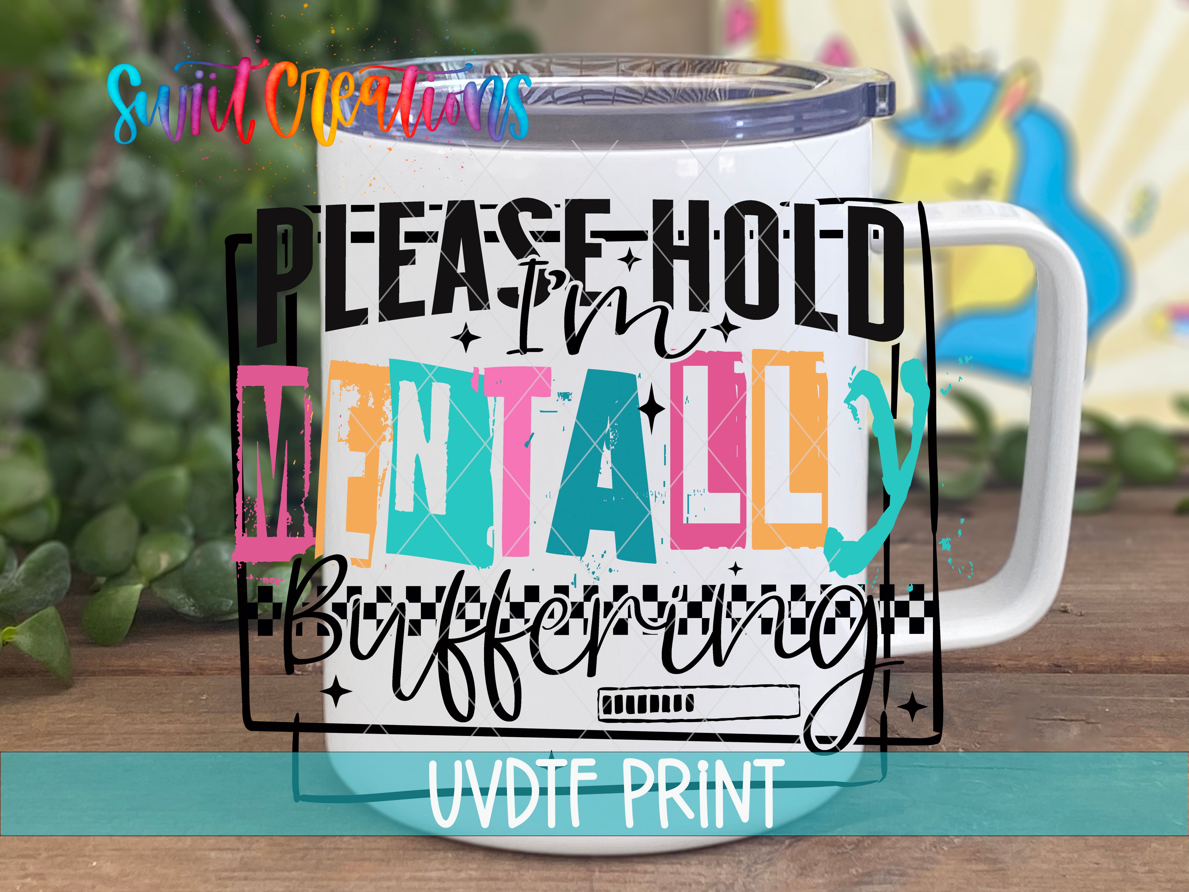 A white mug with a colorful graphic design featuring text and a checkerboard pattern.