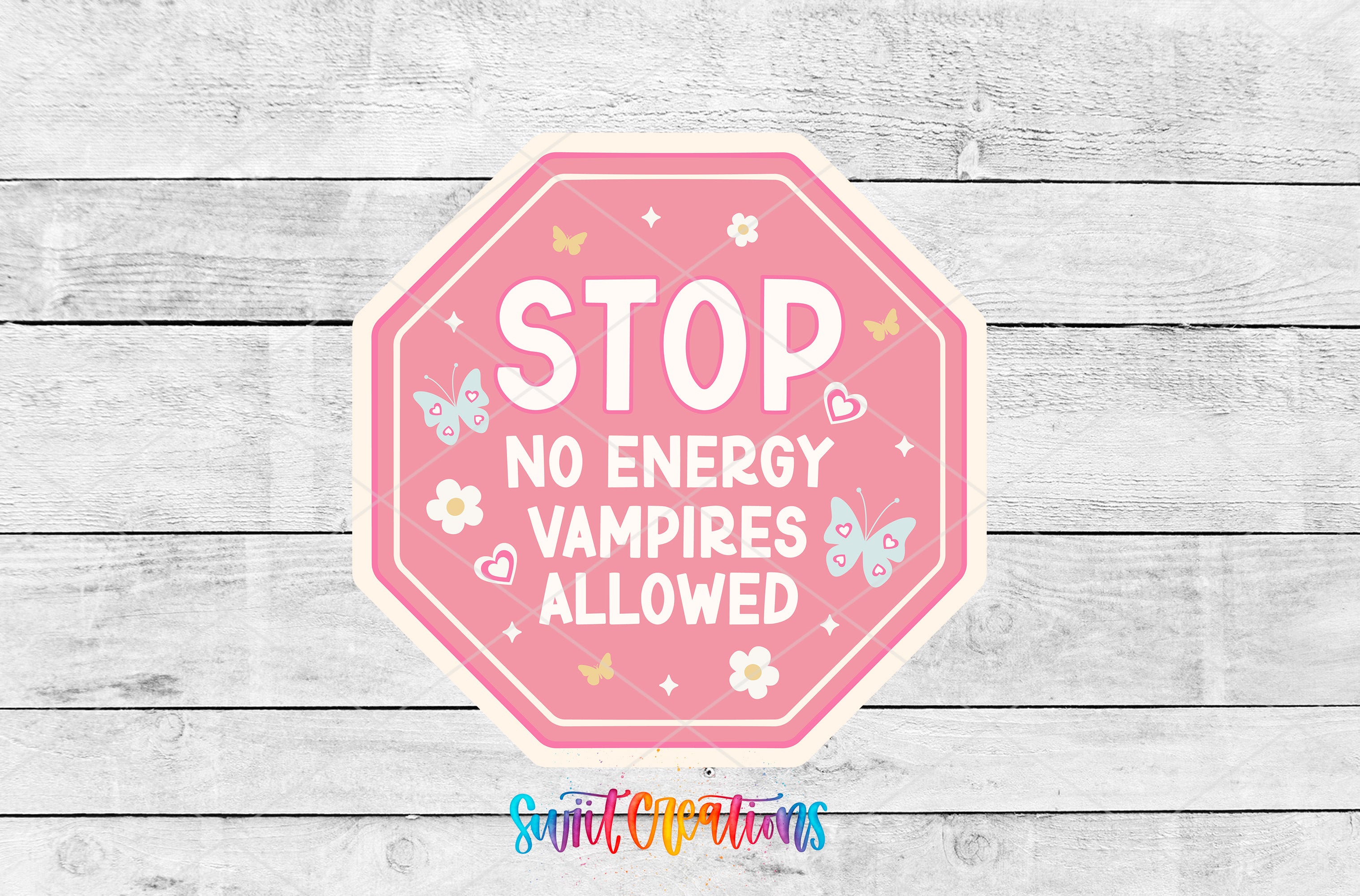 a pink octagonal sign with the text "STOP NO ENERGY VAMPIRE ALLOWED" and various decorative elements such as butterflies and flowers.