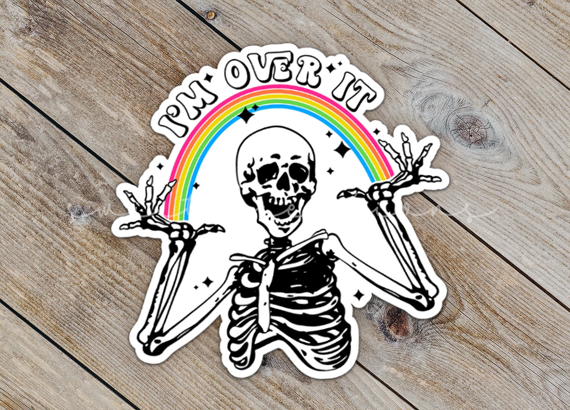 a sticker of a skeleton holding two swords