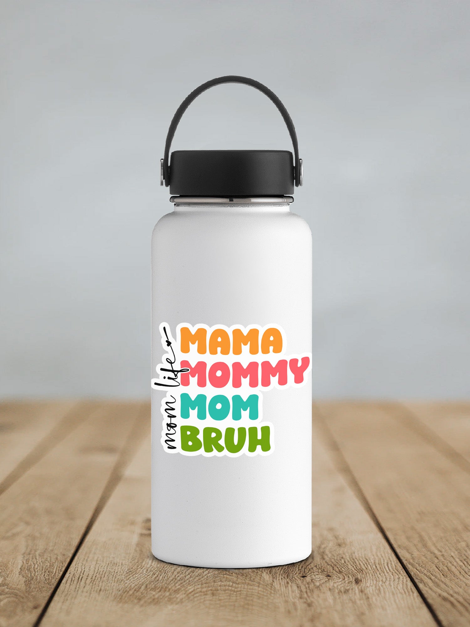 a white water bottle with a black lid on a wooden table