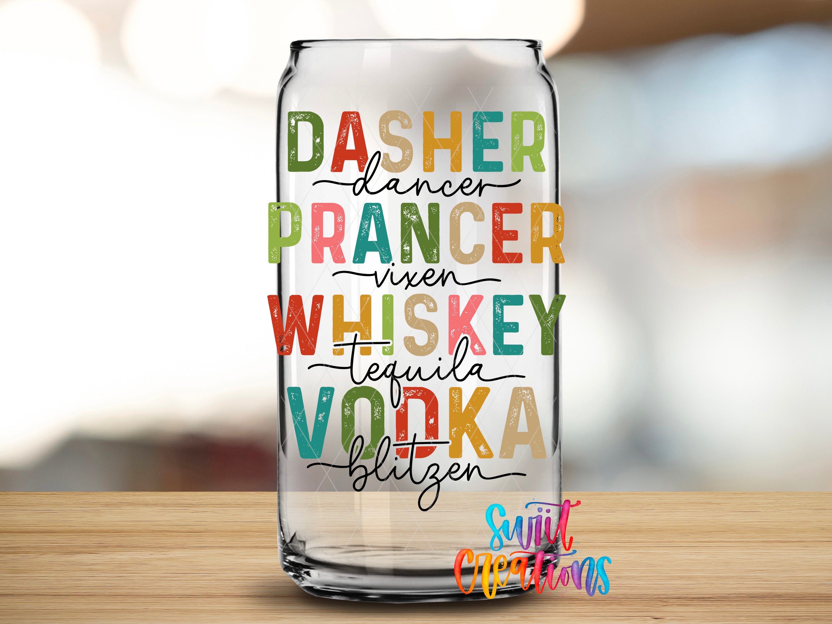 A glass can with text printed on it, sitting on a wooden surface.