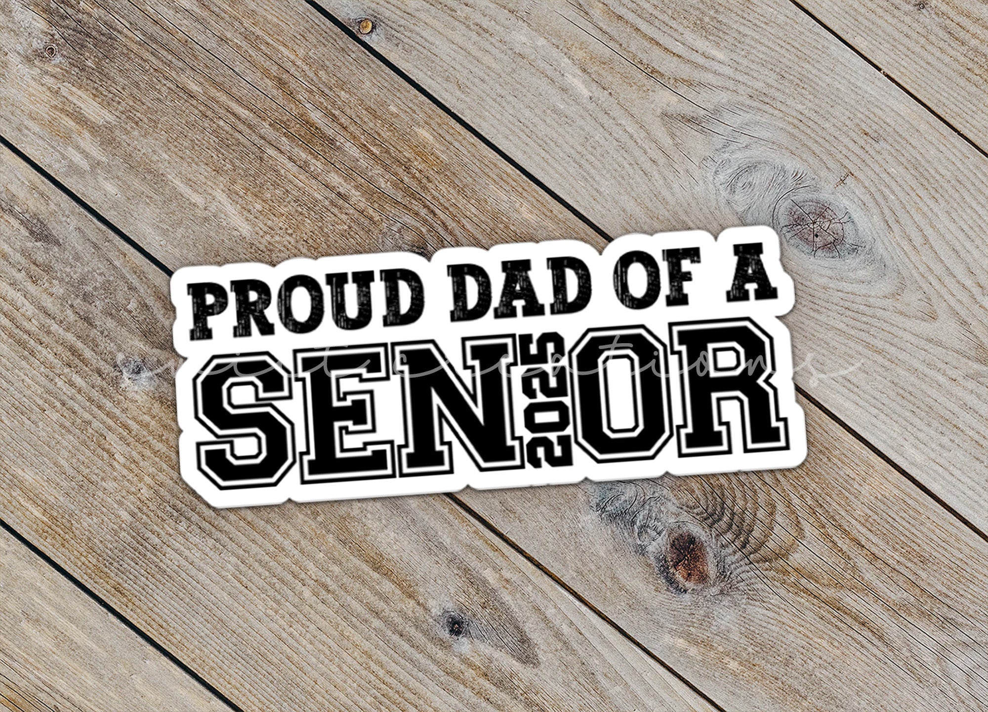 a sticker that says proud dad of a senior