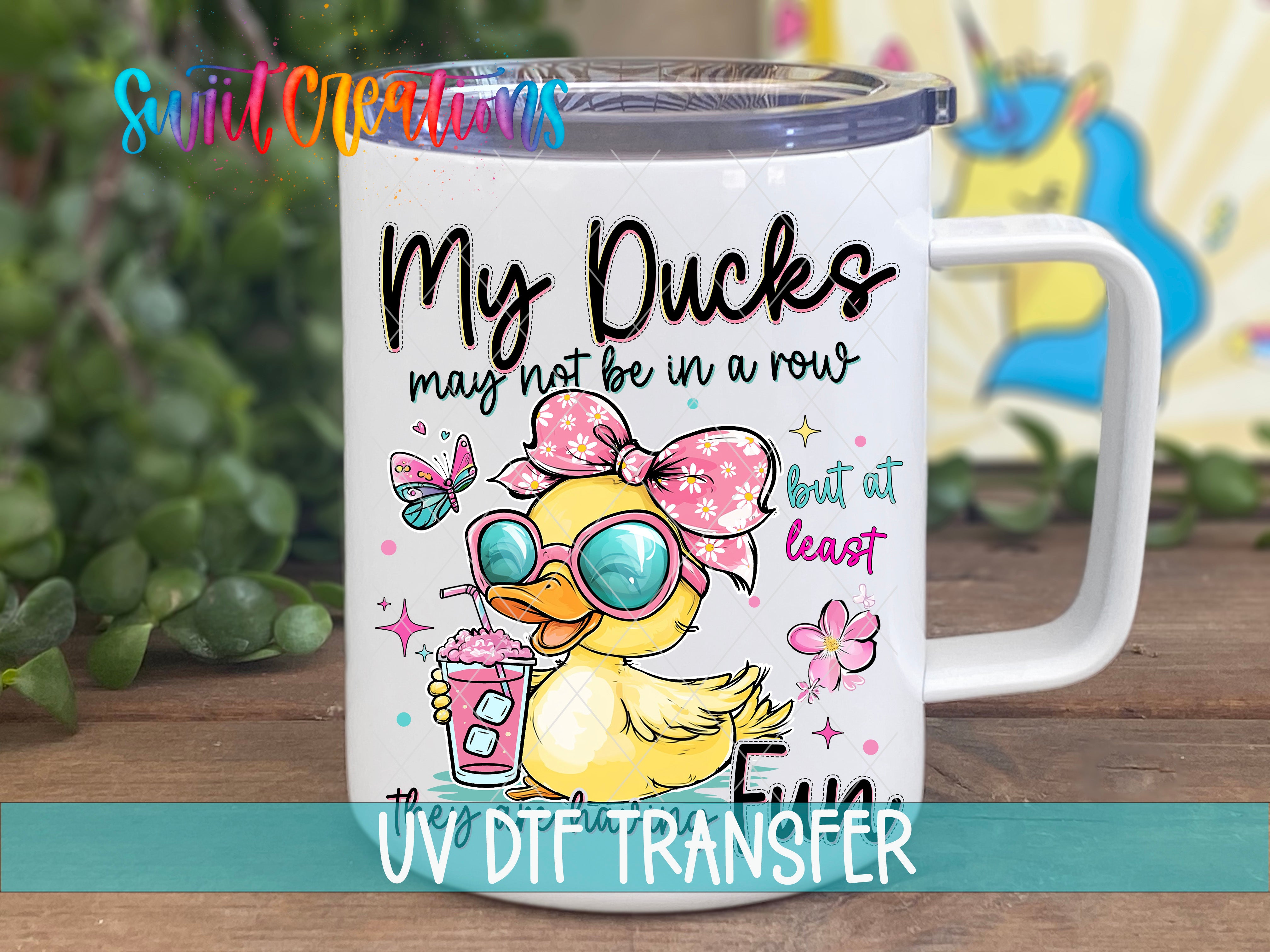 A white mug with a cartoon image of a duck wearing sunglasses and holding a drink.