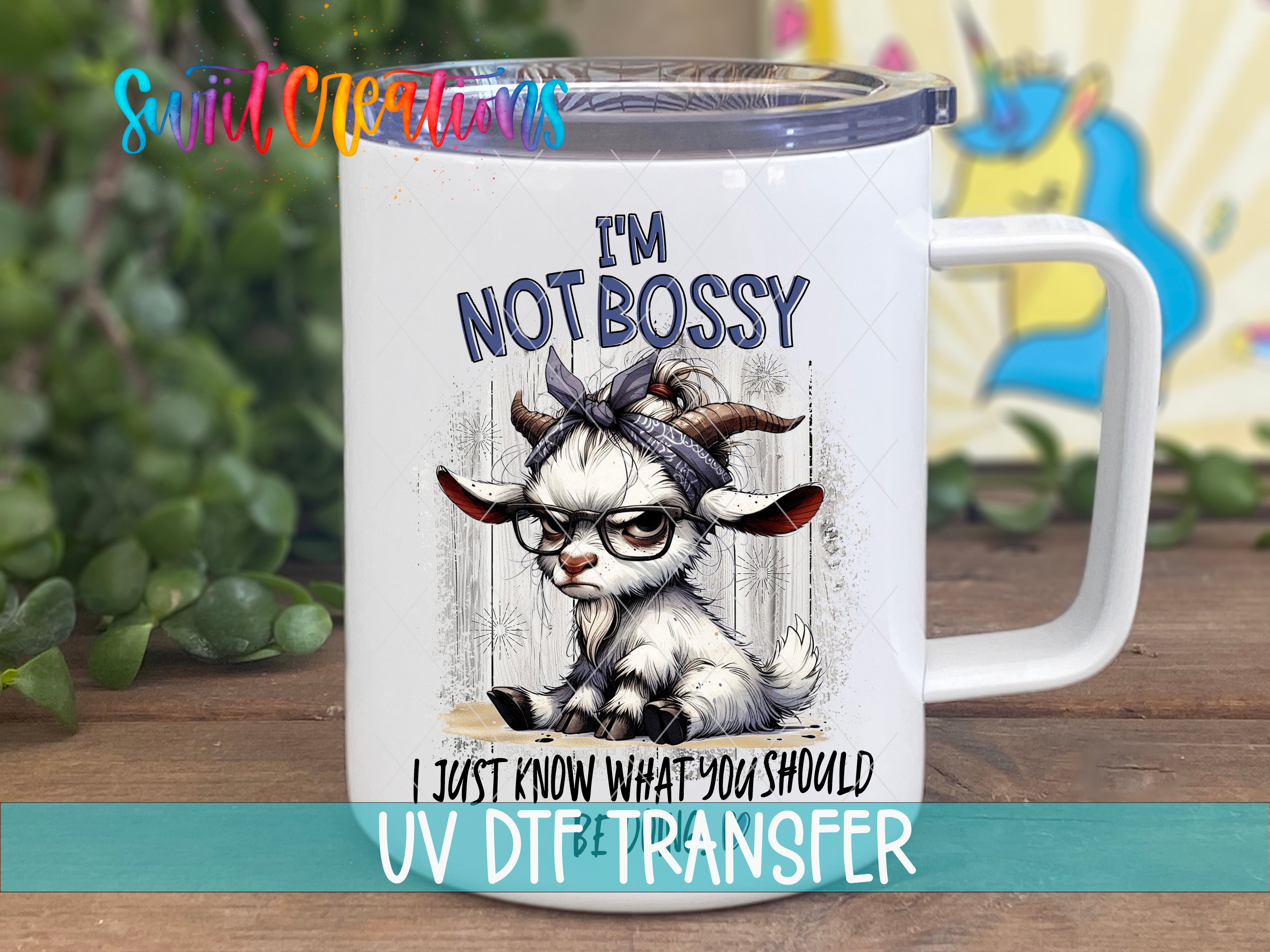 A white mug with a cartoon goat wearing glasses and a bandana, along with the text "I'm NOT BOSSY I JUST KNOW WHAT YOU SHOULD UV DFT TRANSFER".
