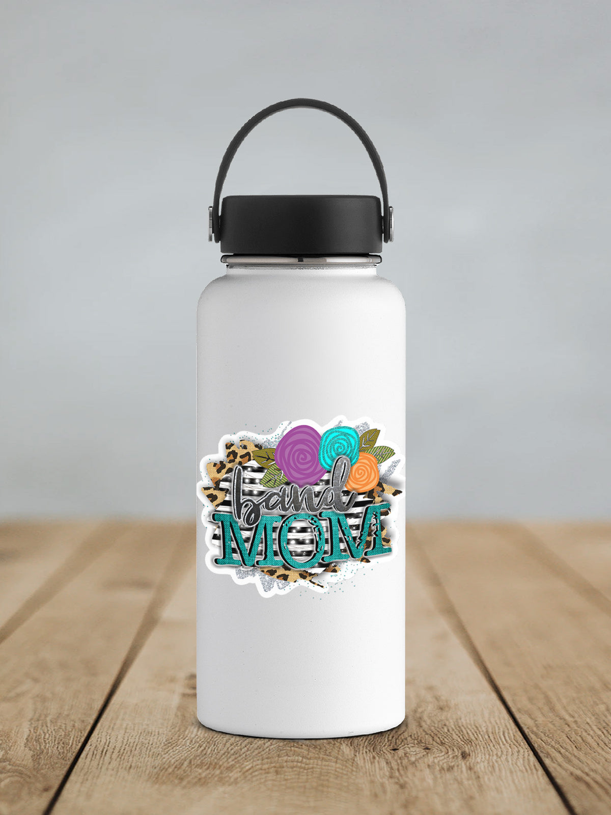 a white water bottle sitting on top of a wooden table
