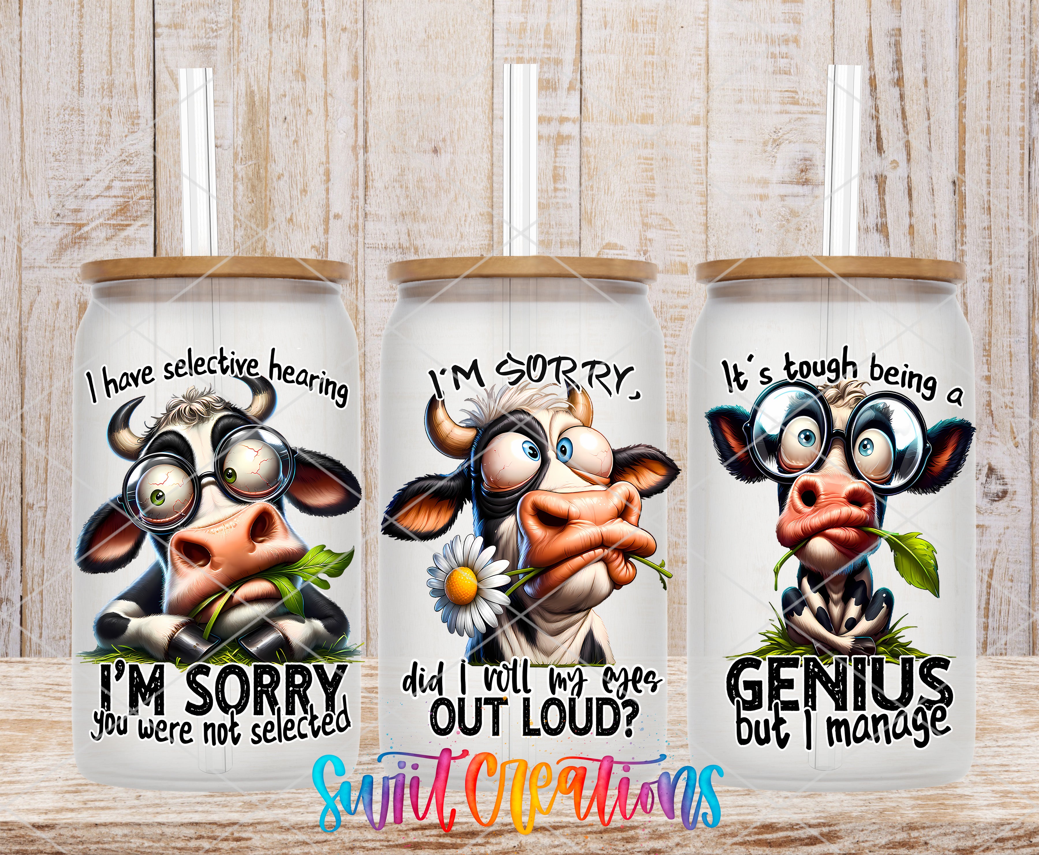 three straw cups with cow designs and humorous text.