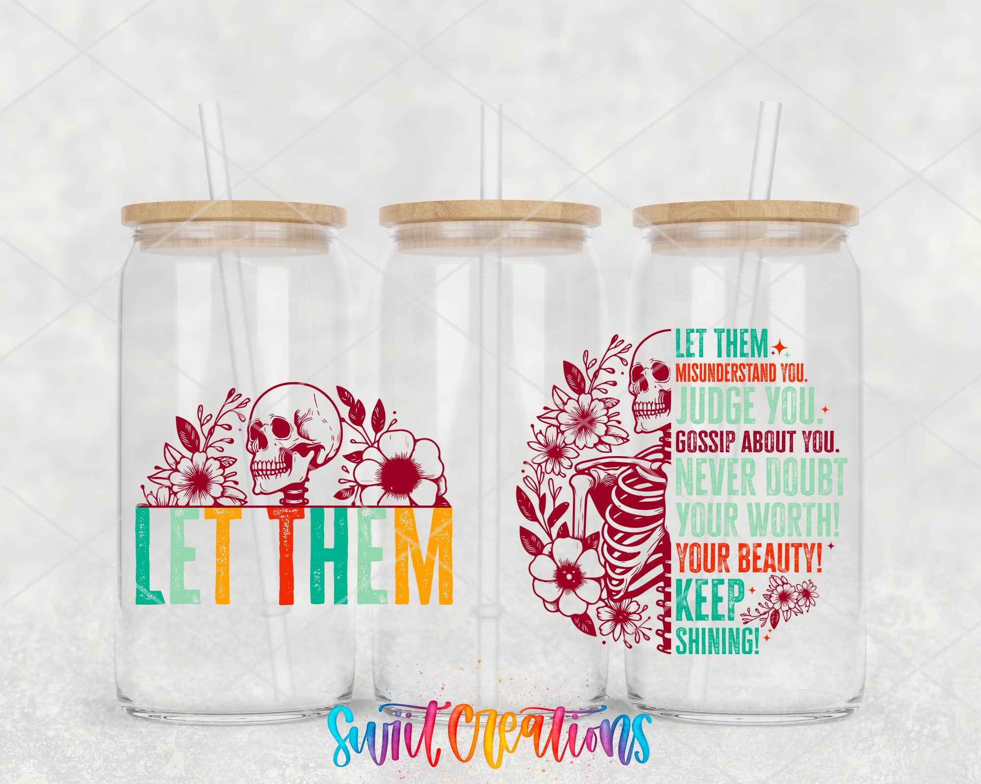three glass jars with colorful designs and straws on top.