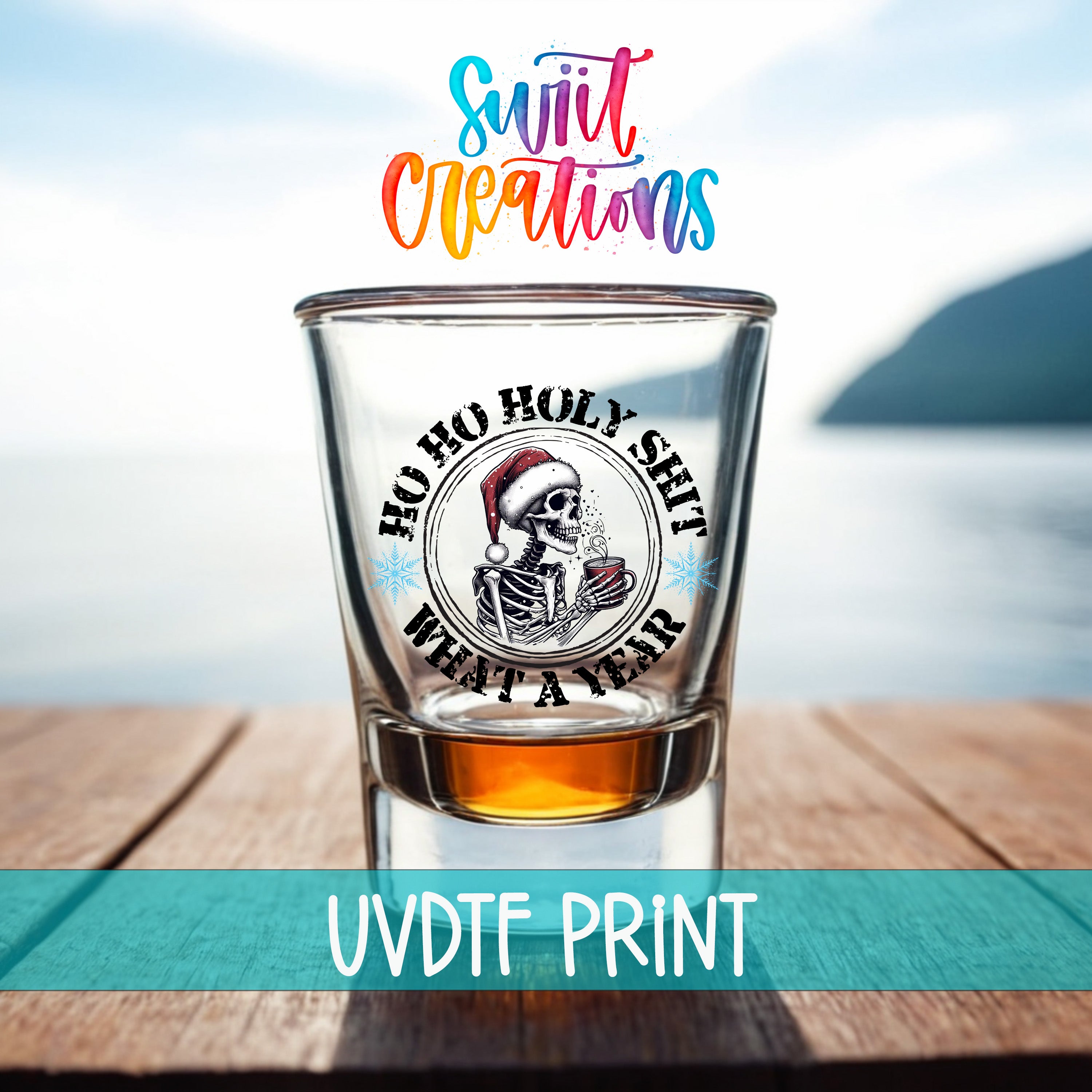 A shot glass with a skull wearing a Santa hat and holding a Christmas tree, with the text "Hoo Ho Holy SHIT WHAT A YEAR" printed on it.
