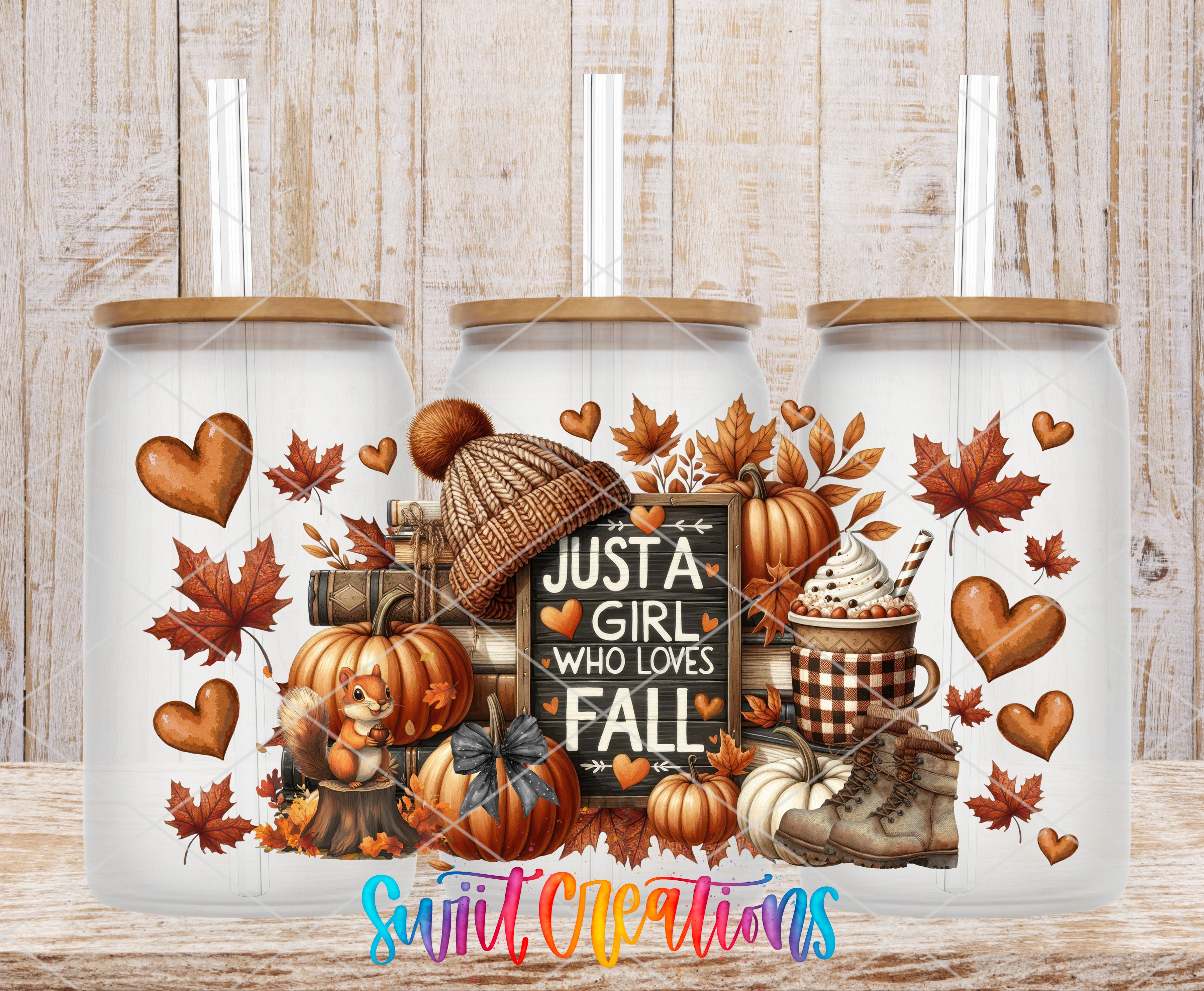 A collection of three glass jars with autumn-themed decorations, including pumpkins, leaves, and a sign that says "Just a Girl Who Loves Fall".