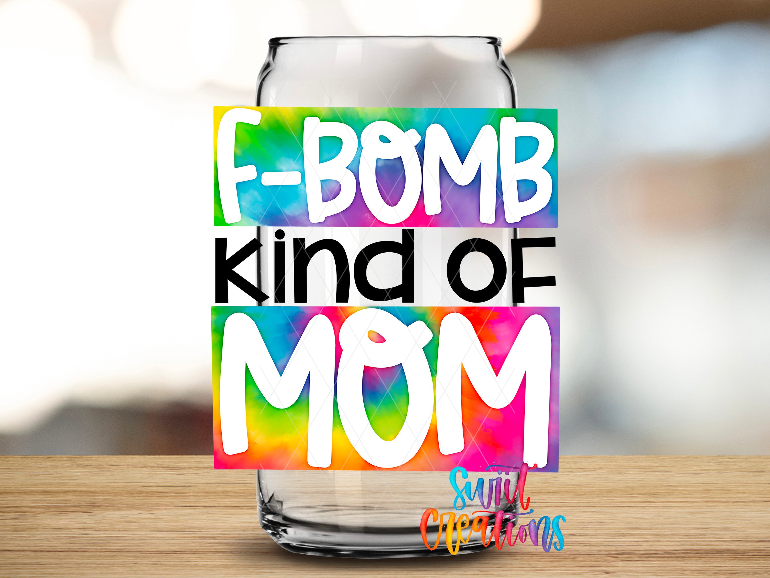 a colorful sticker with the text "F-BOMB KIND OF MOM" on a glass jar or container.
