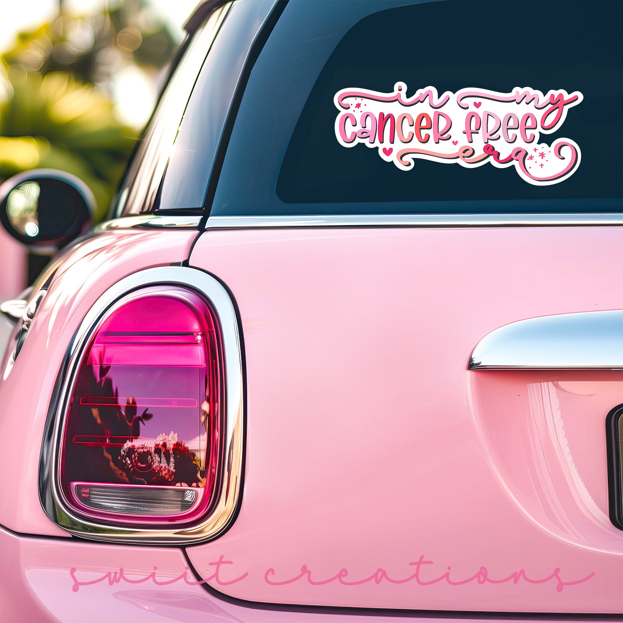 a pink car with a pink sticker on it