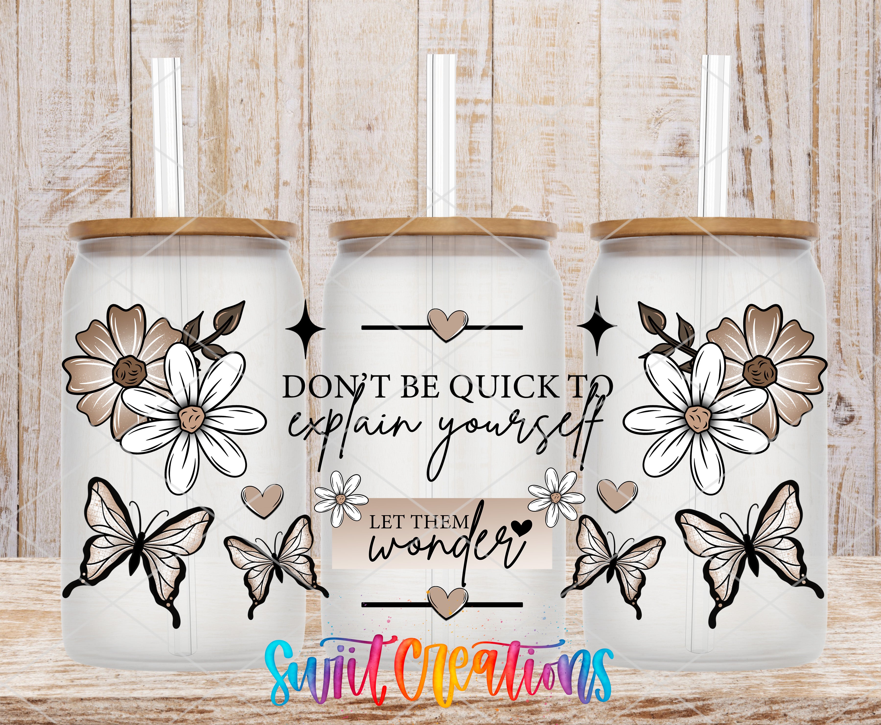 three glass tumblers with floral designs and butterflies, along with a motivational quote and a colorful watermark.