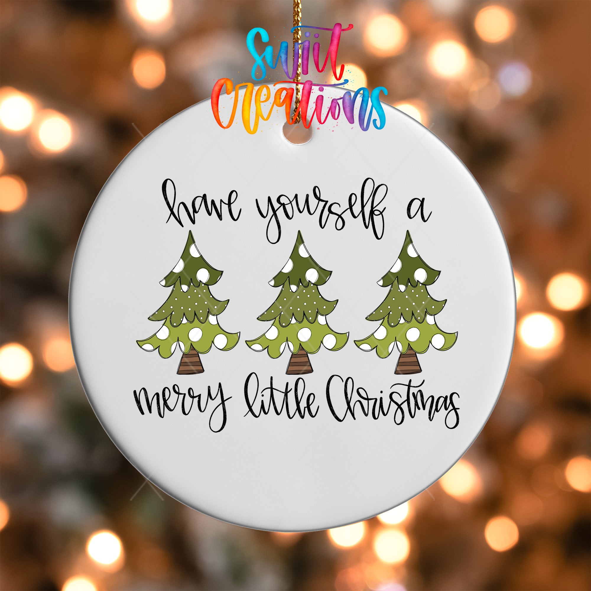 A white ornament with a message about having oneself a Merry Little Christmas.