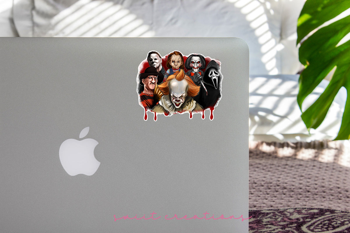 a laptop with stickers on it sitting on a table