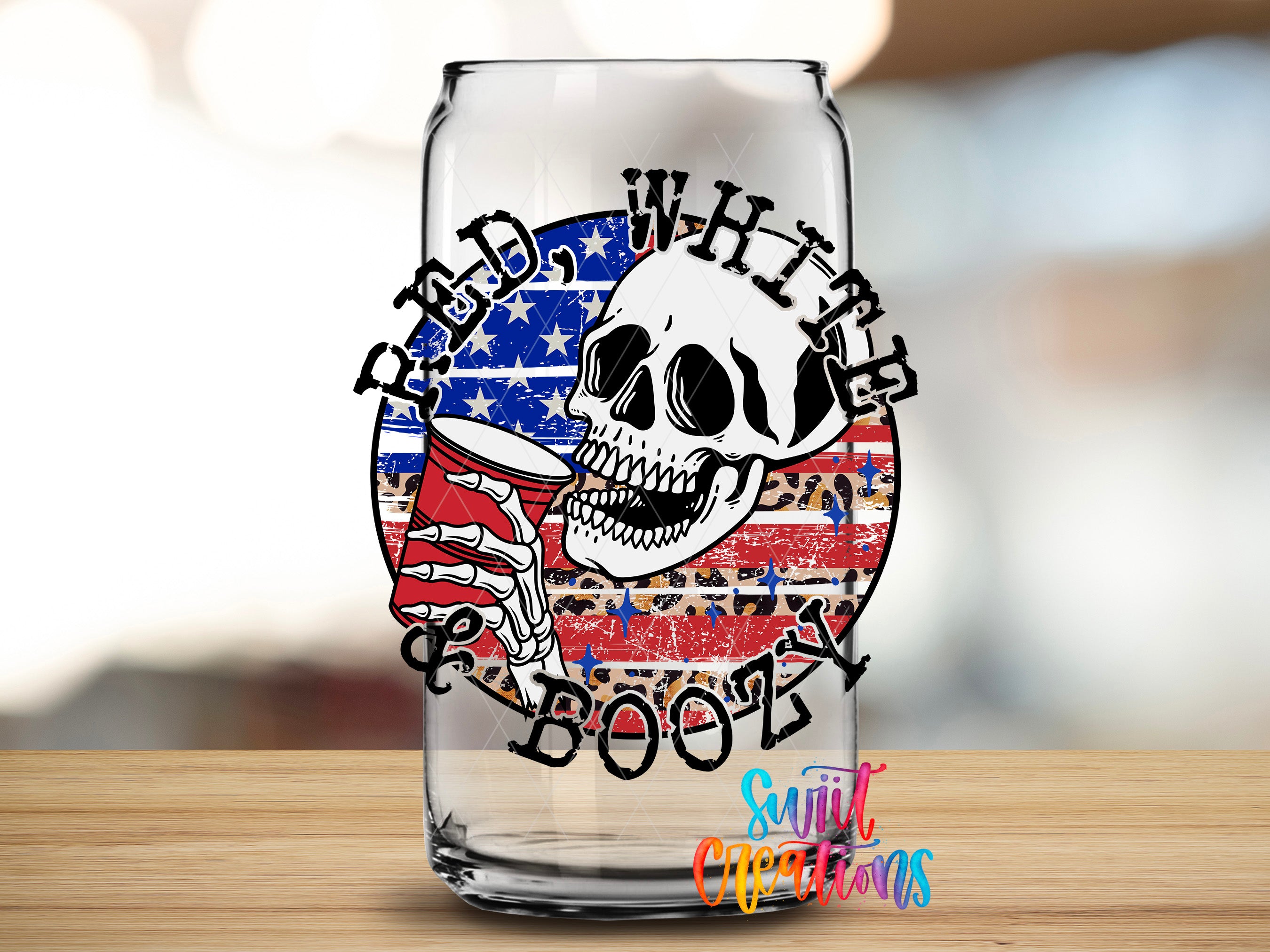 A glass with a skull and beer mug design, featuring the text "RAD. WHITE. BOOOZ" and an American flag pattern.