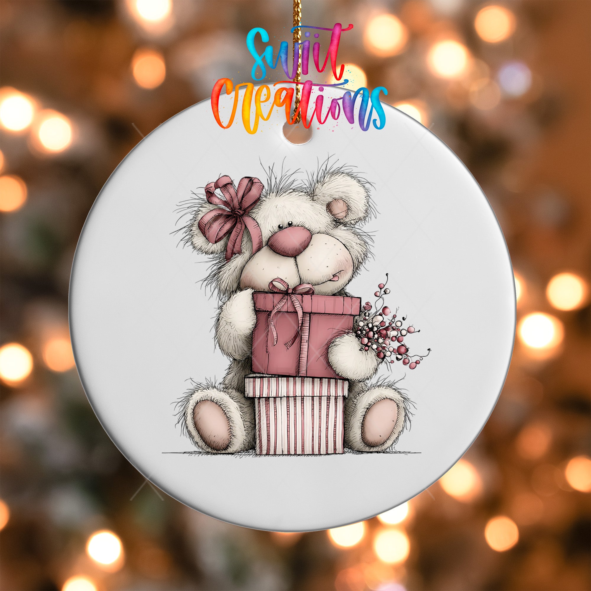 A white ceramic ornament featuring a cute teddy bear holding a gift box and flowers, with a colorful text overlay that reads "Sweet Creations".