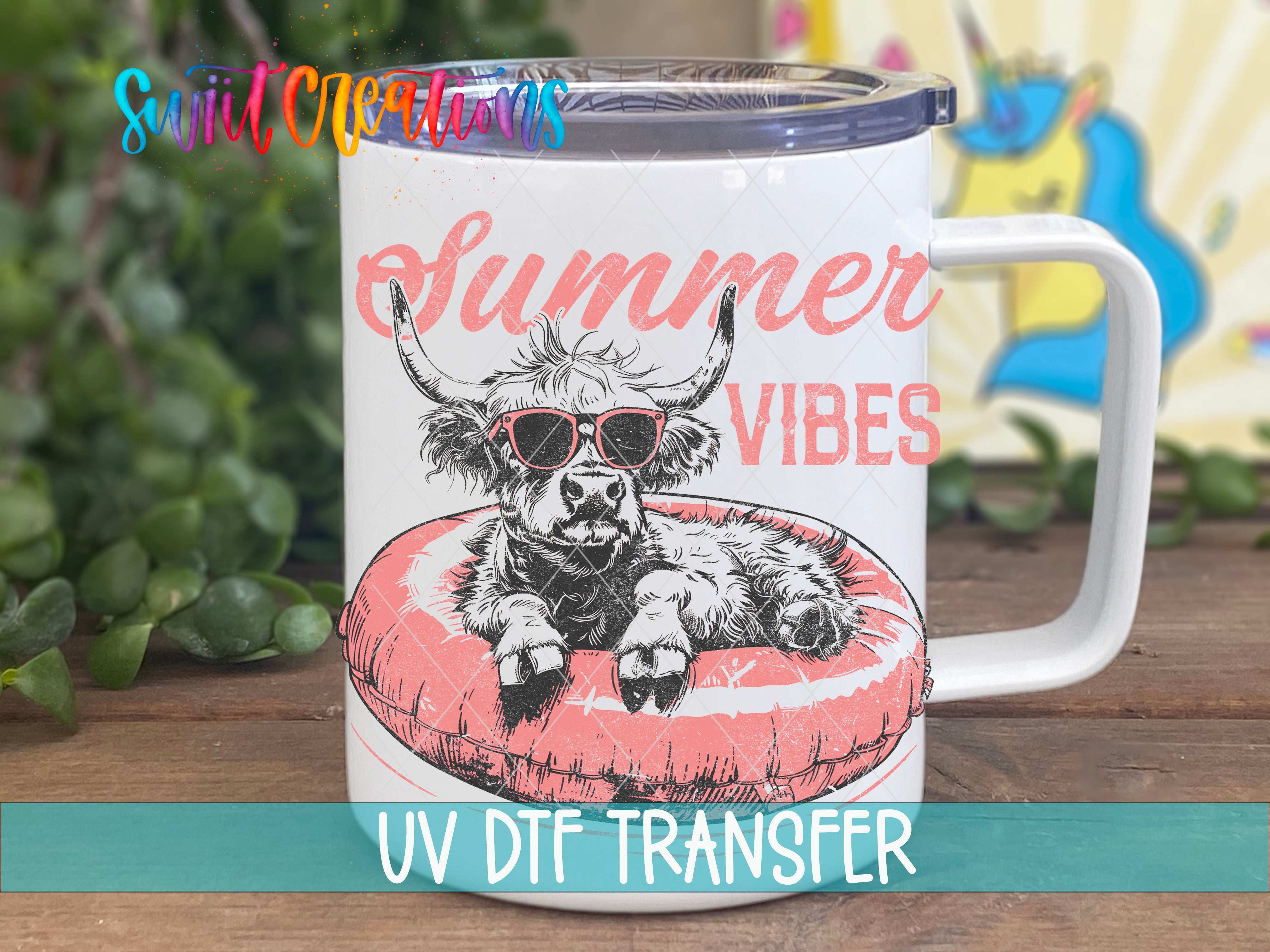 A white mug with a printed design of a cow wearing sunglasses and resting on a red inner tube, with the text "Summer Vibes" and "UV Dtf Transfer" printed on it.