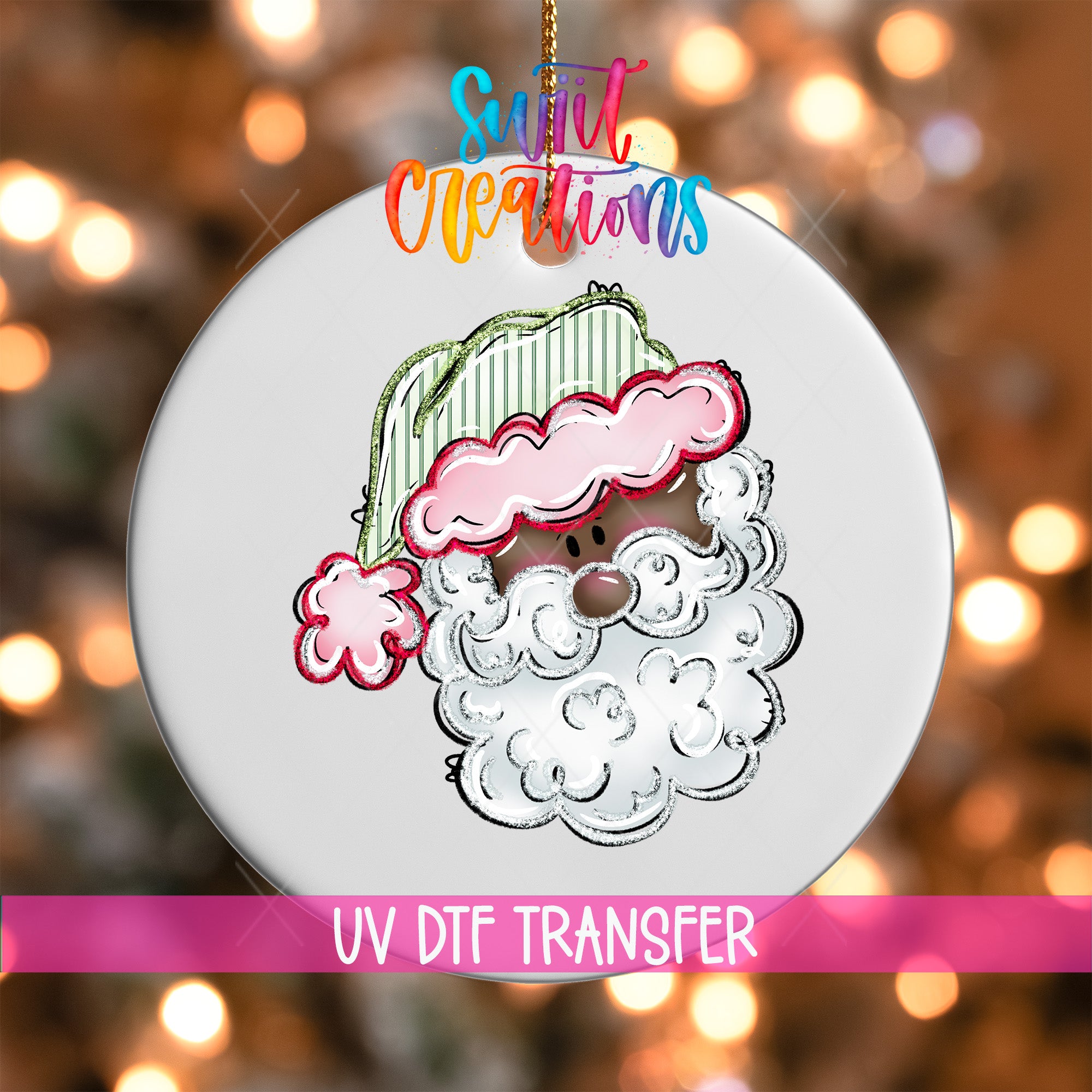 A white ornament with a Santa Claus face and a pink hat, along with the text "UV Dtf Transfer" and "Sweet Creations" written above it.