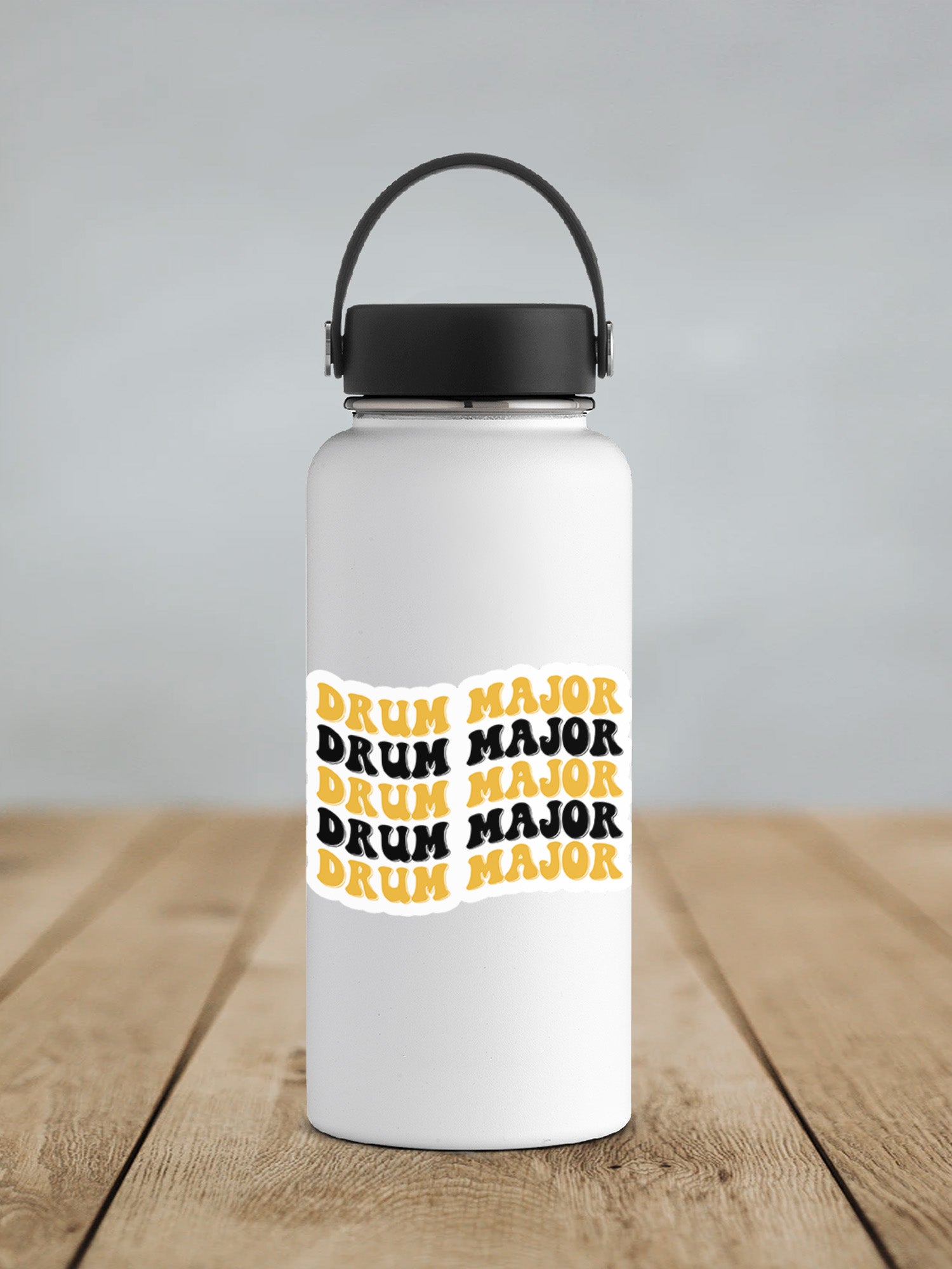 a white water bottle sitting on top of a wooden table