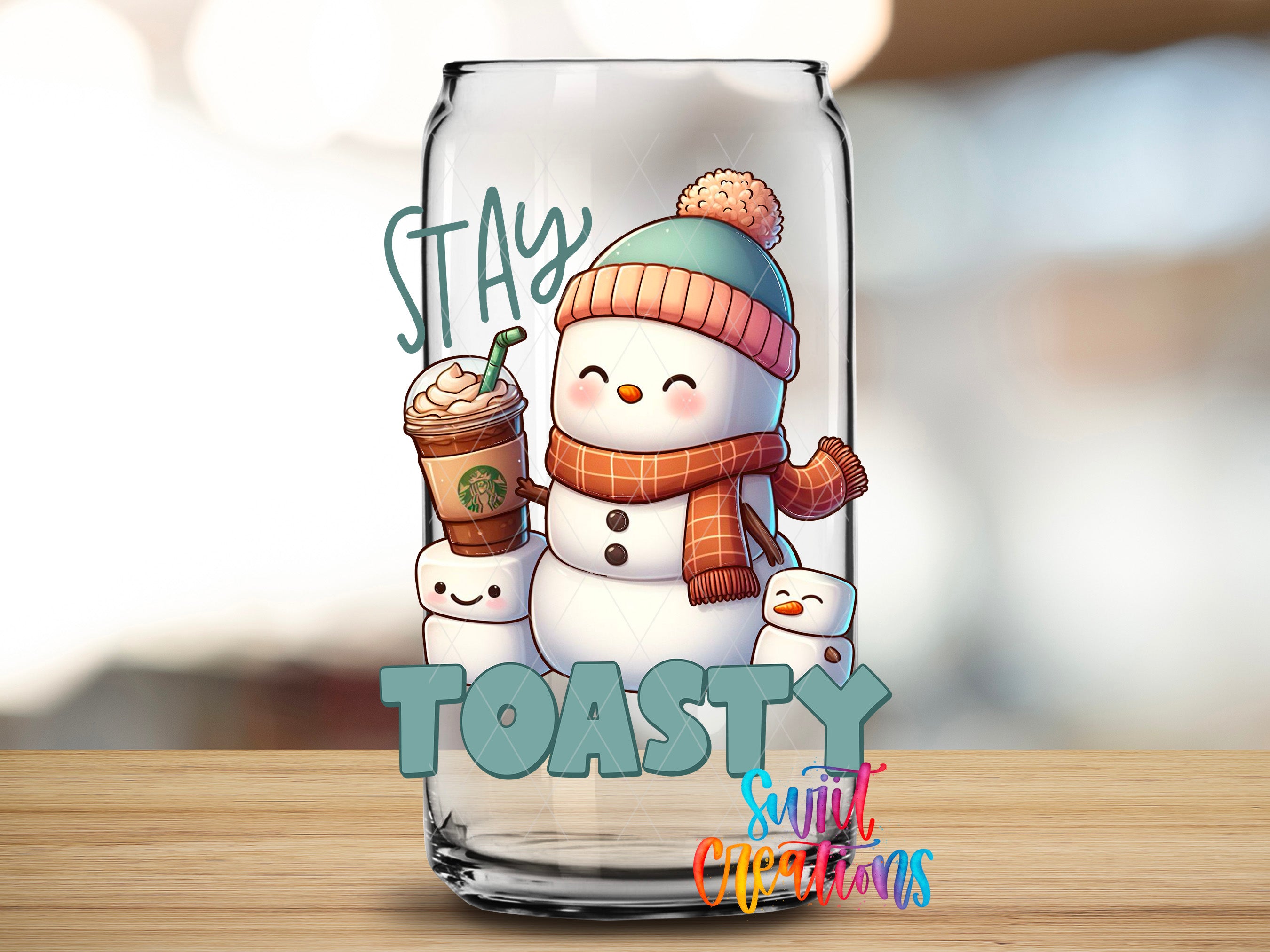 A glass can with a snowman and a cup of coffee, along with the text "STAY TOASTY" and "SUNNY CHRISTMAS" printed on it.